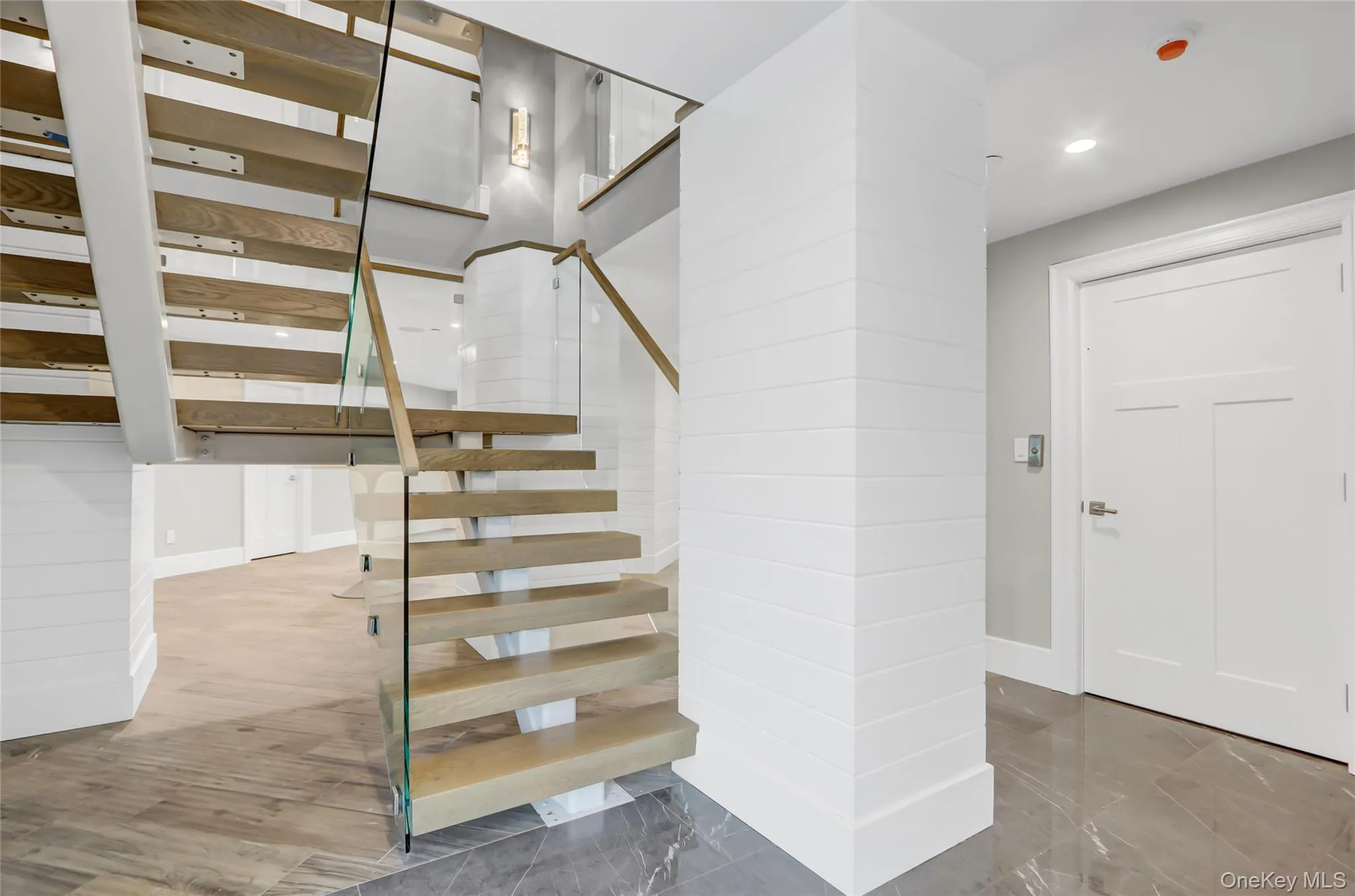 Stairway featuring recessed lighting and baseboards Stairway featuring recessed lighting and baseboards