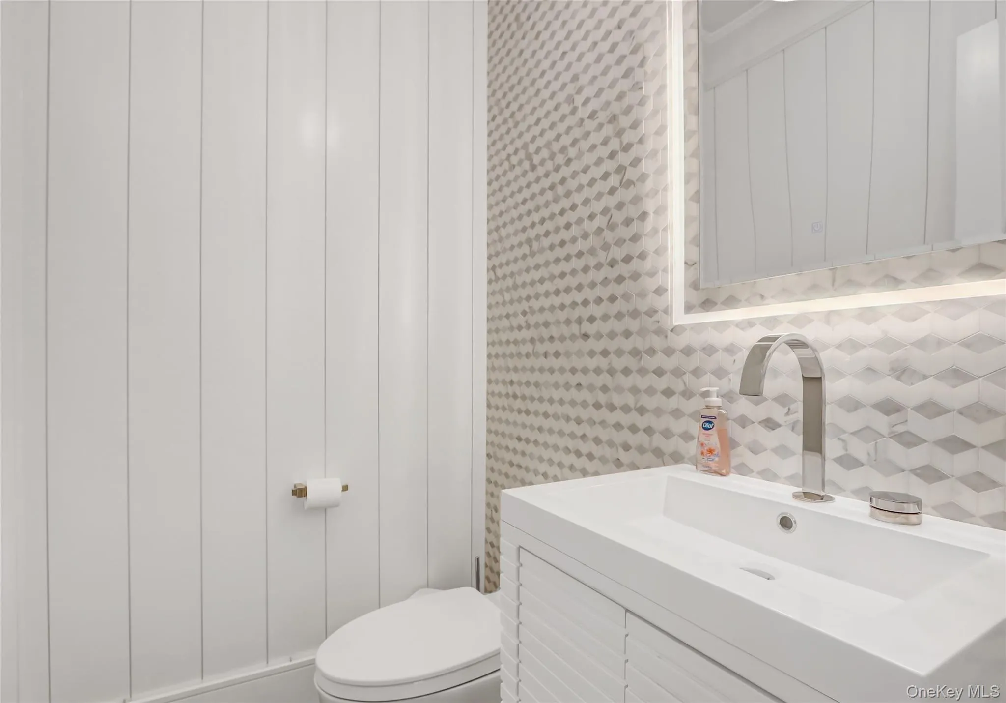 Bathroom featuring vanity and toilet Bathroom featuring vanity and toilet