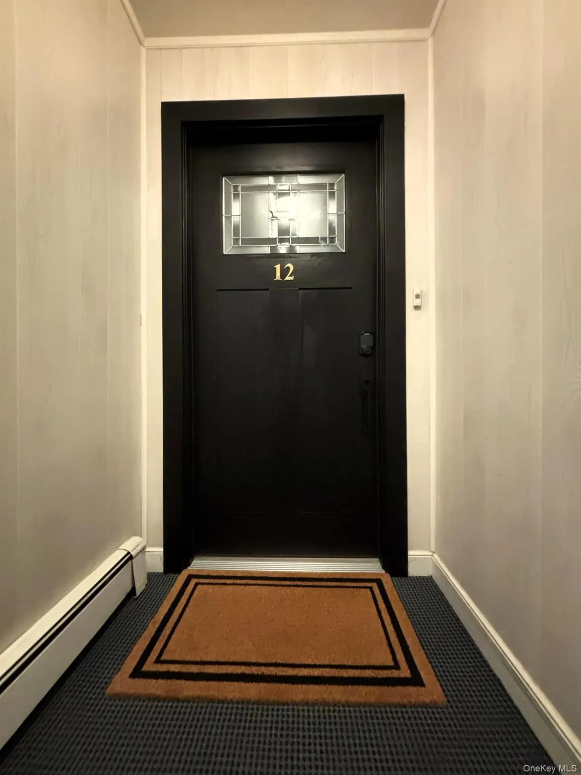 Entrance to property featuring a baseboard radiator Entrance to property featuring a baseboard radiator