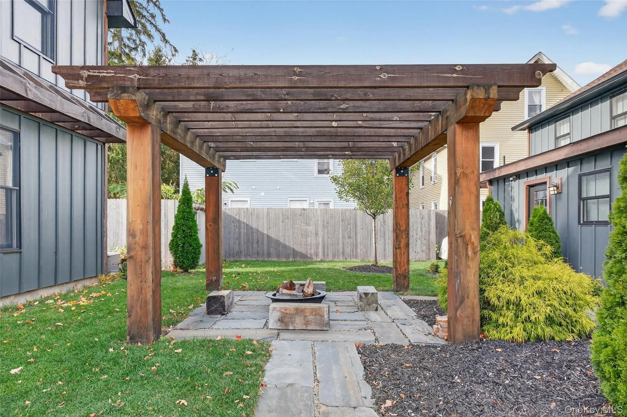 Shared patio with pergola and firepit Shared patio with pergola and firepit