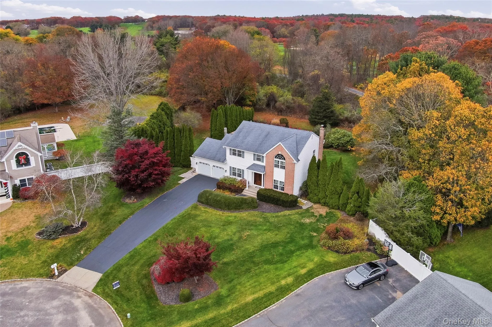 View from above of property featuring a heavily wooded area View from above of property featuring a heavily wooded area