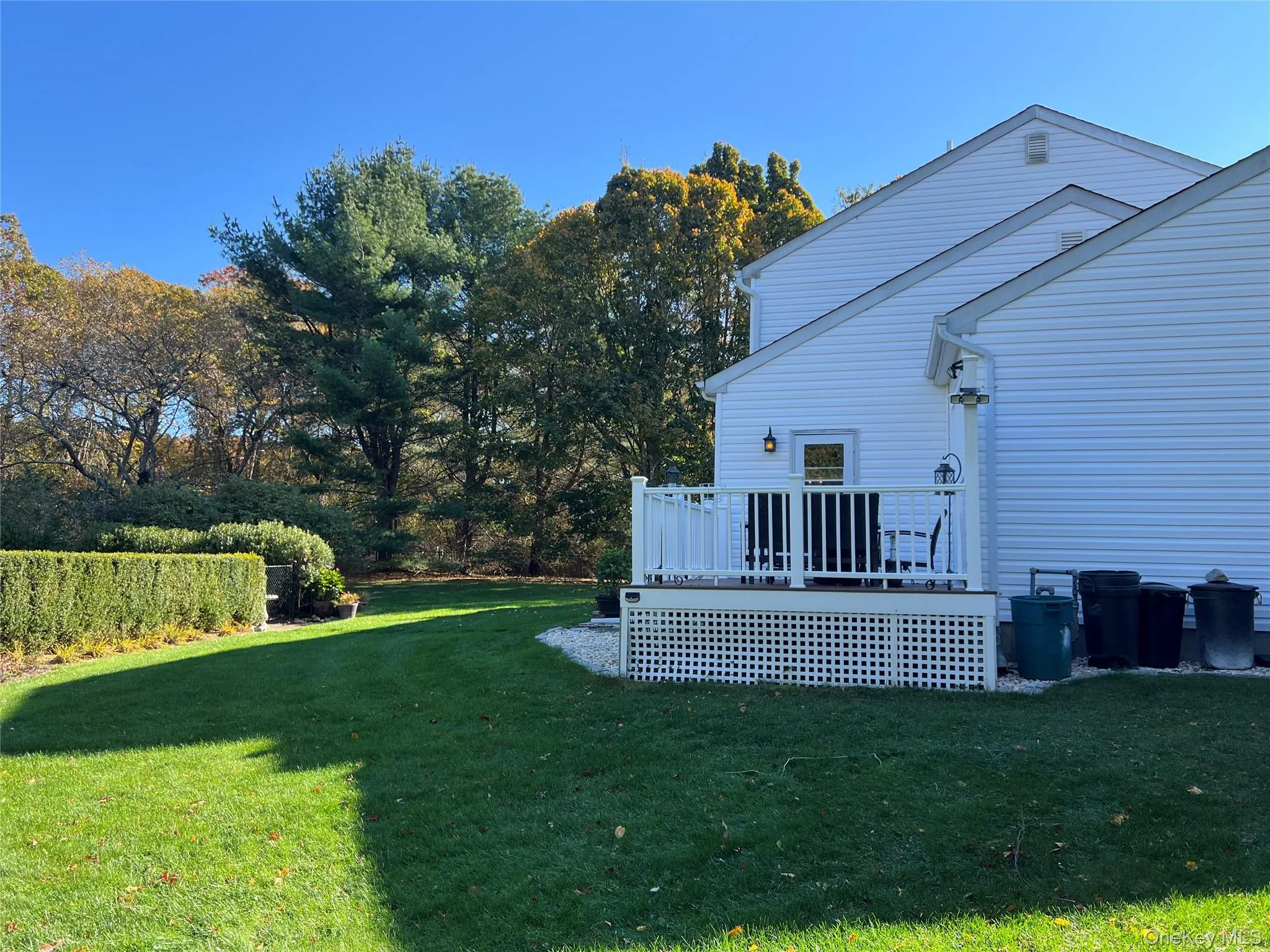 View of grassy yard with a deck View of grassy yard with a deck