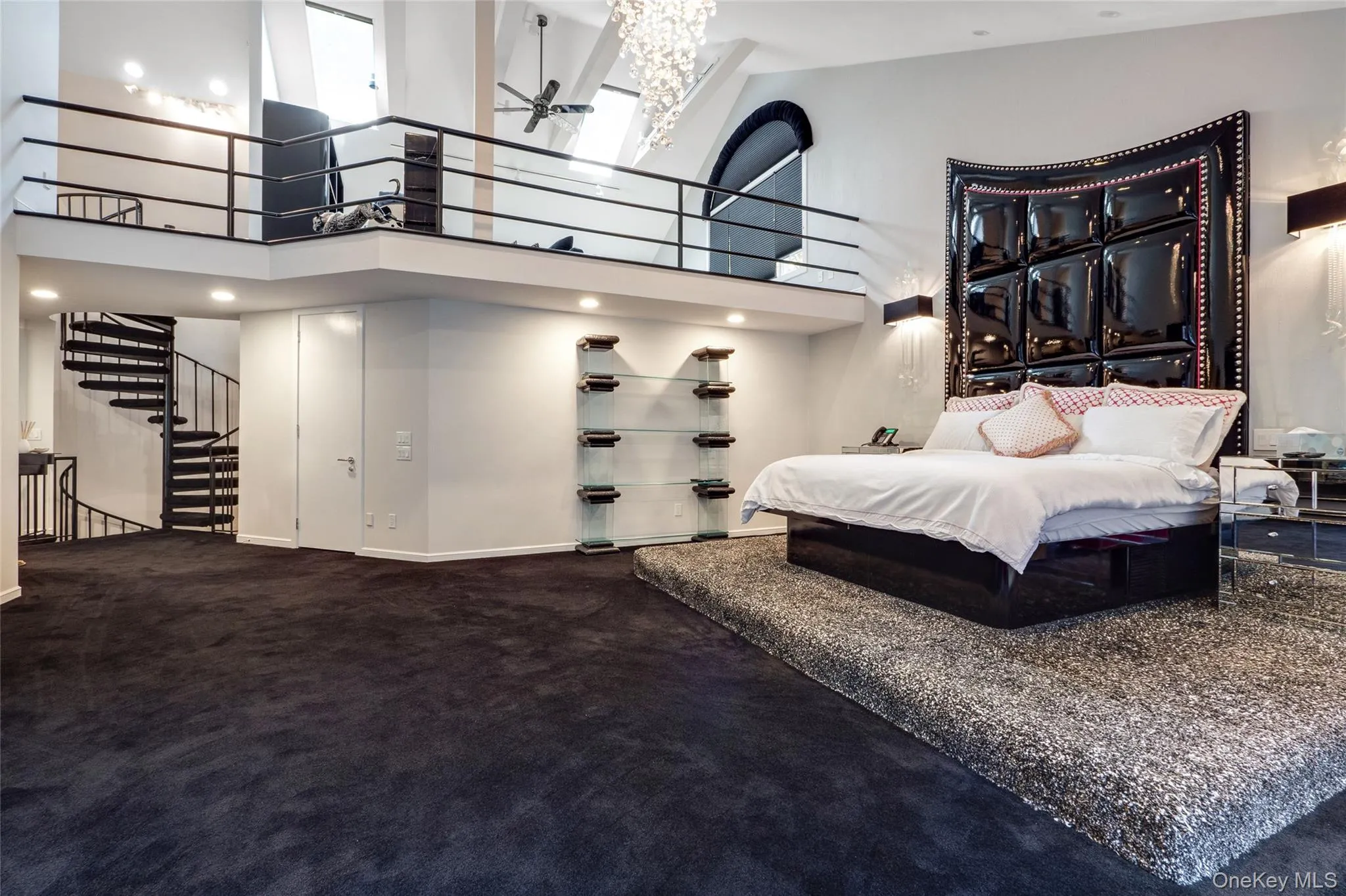 Carpeted bedroom with a towering ceiling Carpeted bedroom with a towering ceiling