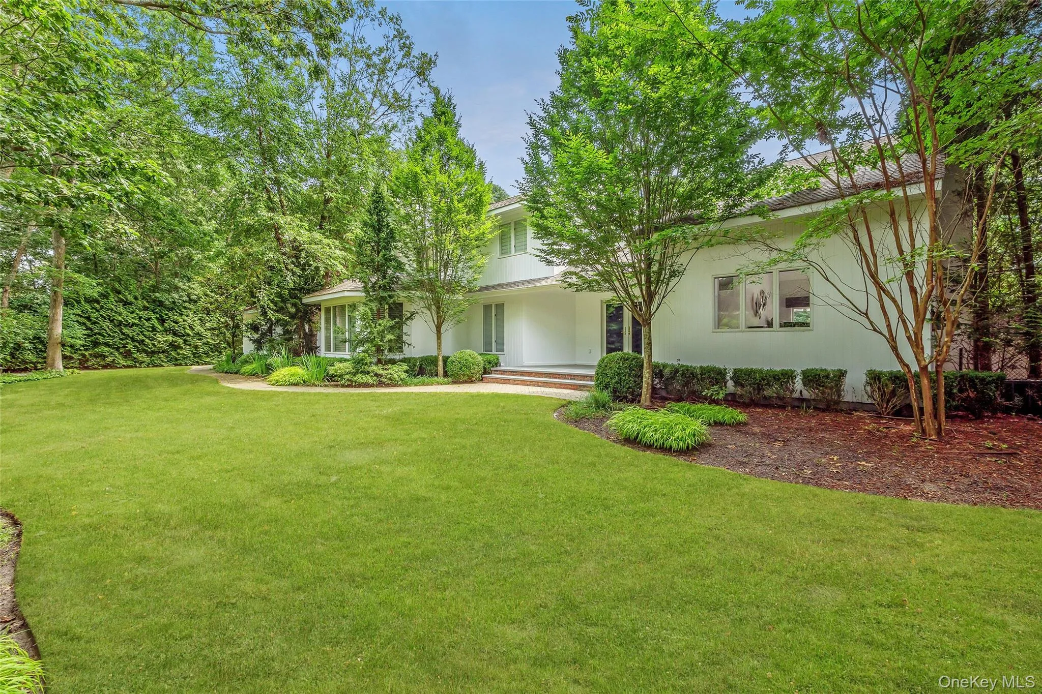 View of front of house featuring a front lawn and a porch View of front of house featuring a front lawn and a porch