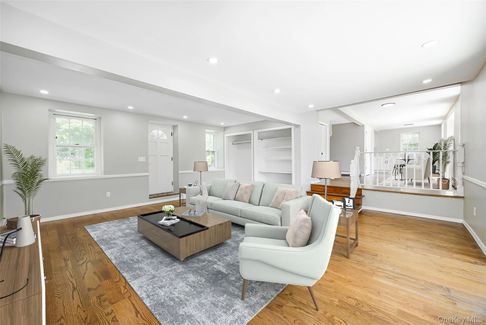 Living area with wood finished floors and recessed lighting Living area with wood finished floors and recessed lighting