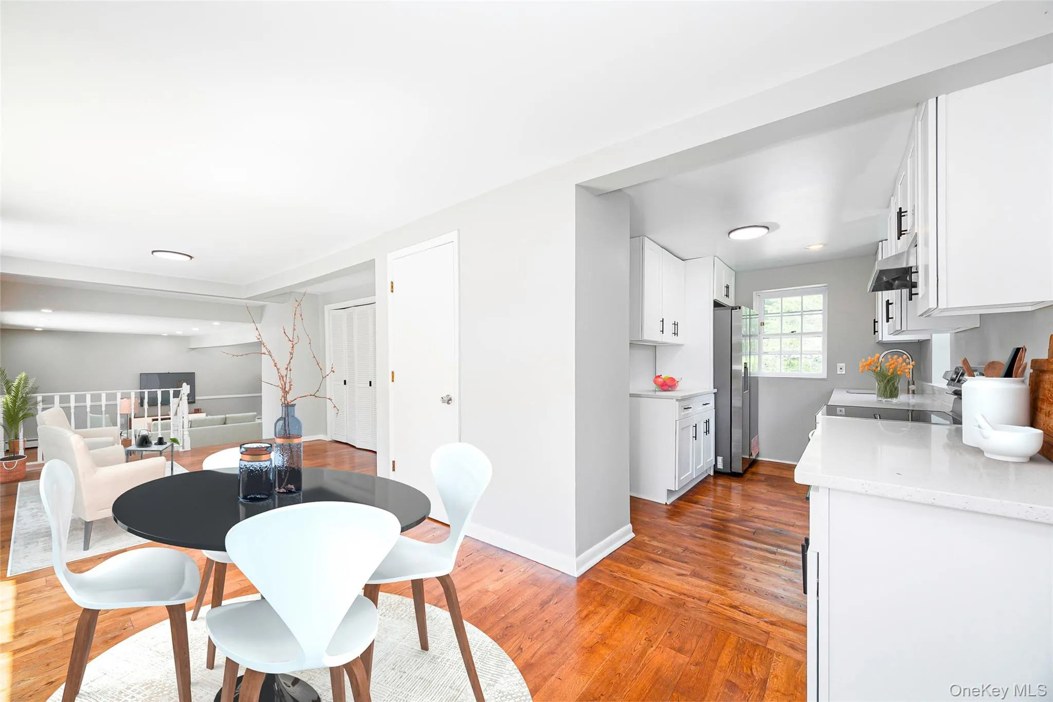 Dining area with light wood-style floors and baseboards Dining area with light wood-style floors and baseboards