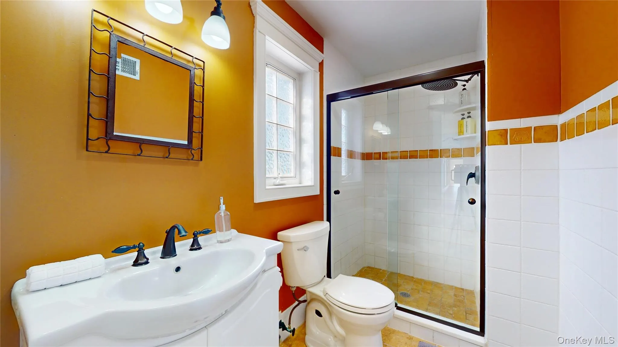 Bathroom featuring vanity and a shower stall Bathroom featuring vanity and a shower stall