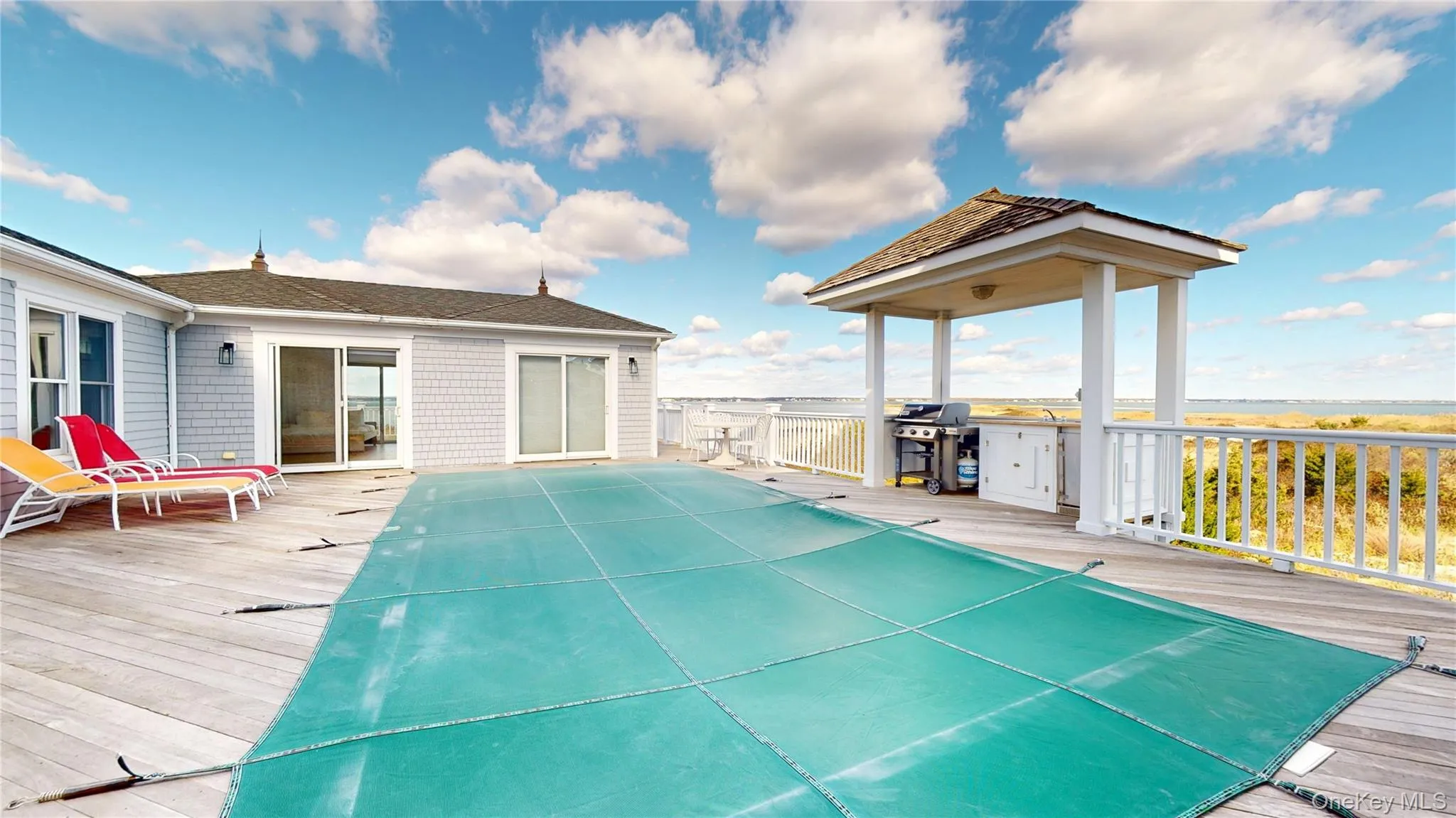 Deck featuring a patio and grilling area Deck featuring a patio and grilling area