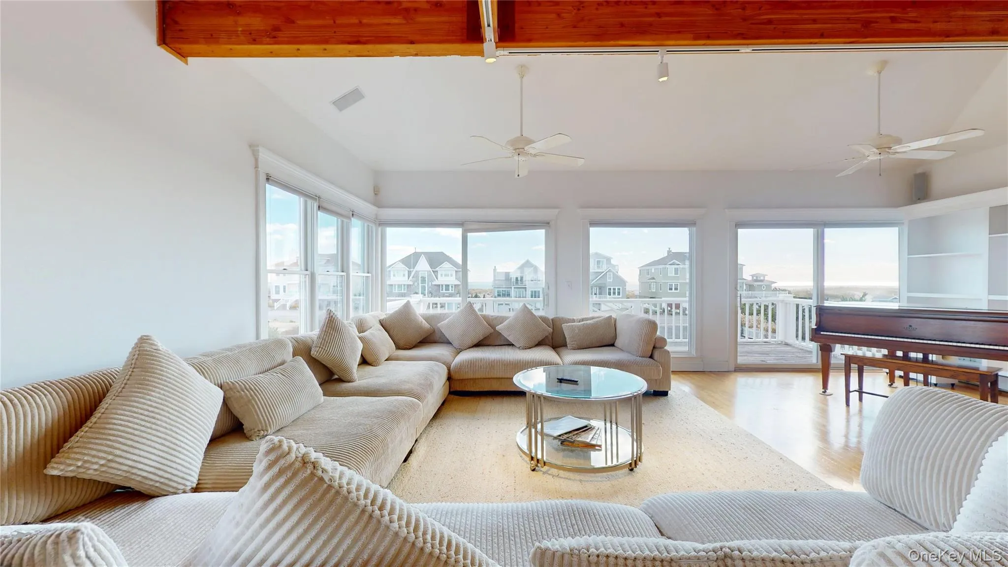 Sunroom / solarium with healthy amount of natural light and rail lighting Sunroom / solarium with healthy amount of natural light and rail lighting