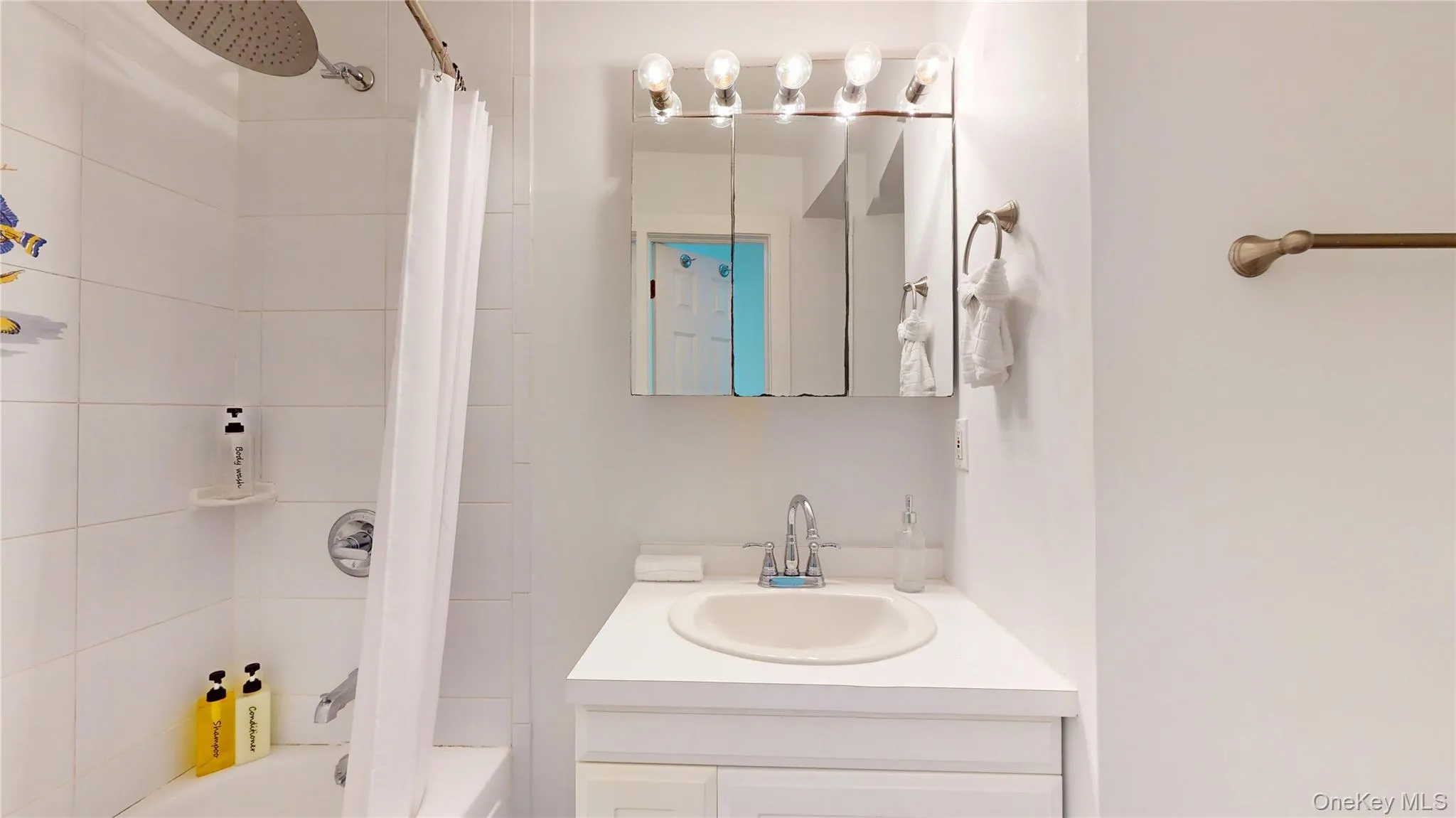 Full bath with vanity and shower / tub combo with curtain Full bath with vanity and shower / tub combo with curtain