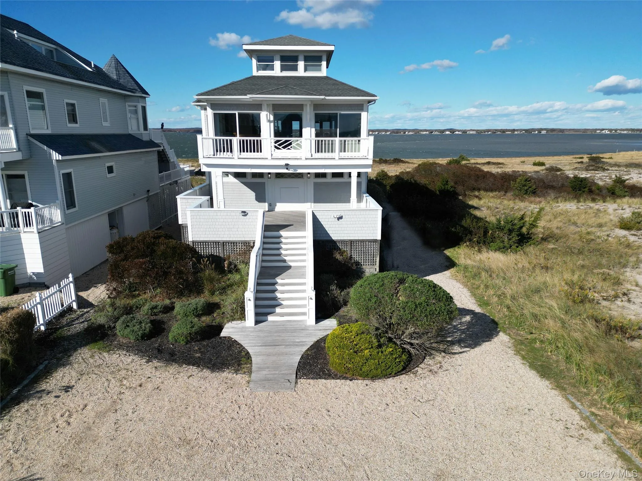 View of front of property with stairway and a balcony View of front of property with stairway and a balcony