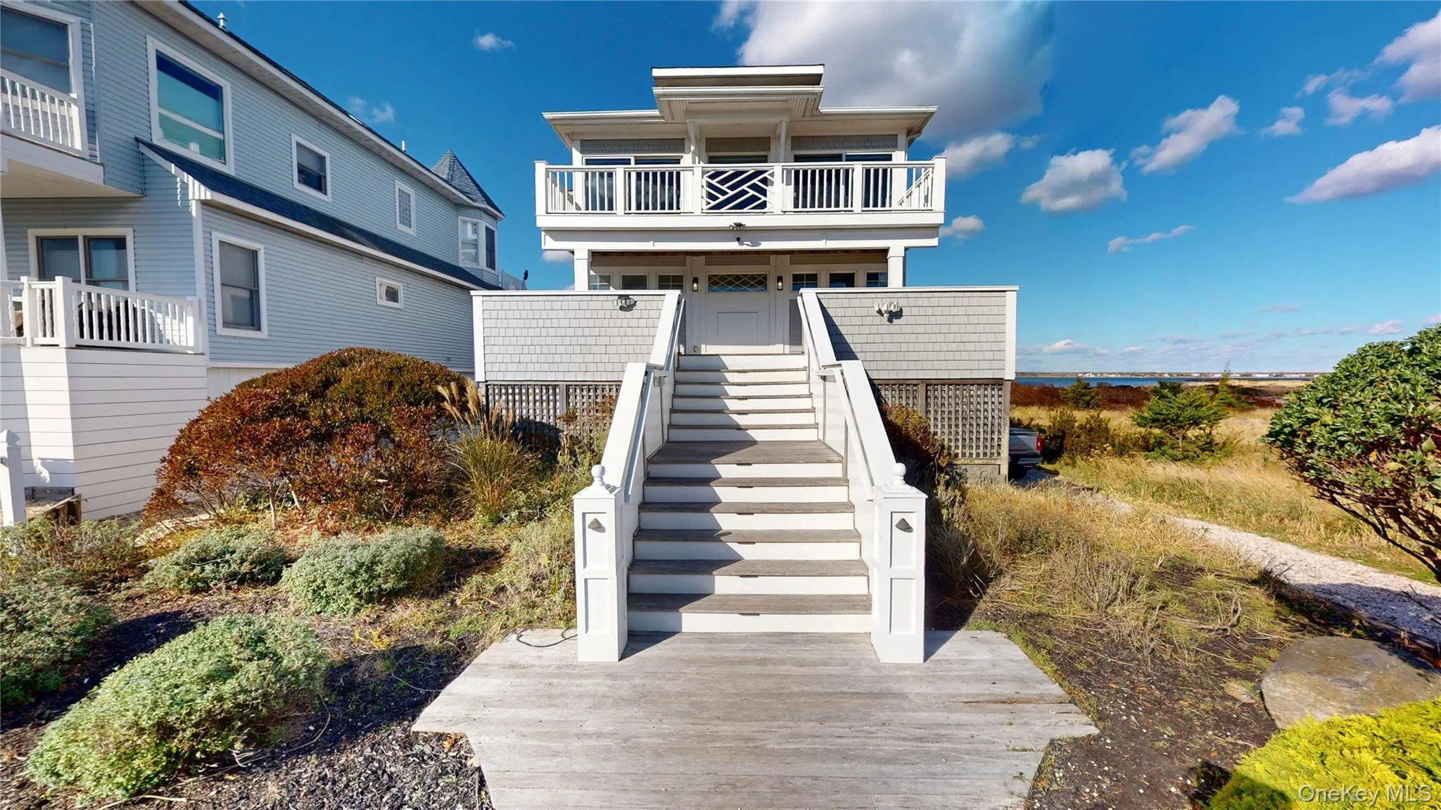 View of front of house with a balcony and stairs View of front of house with a balcony and stairs