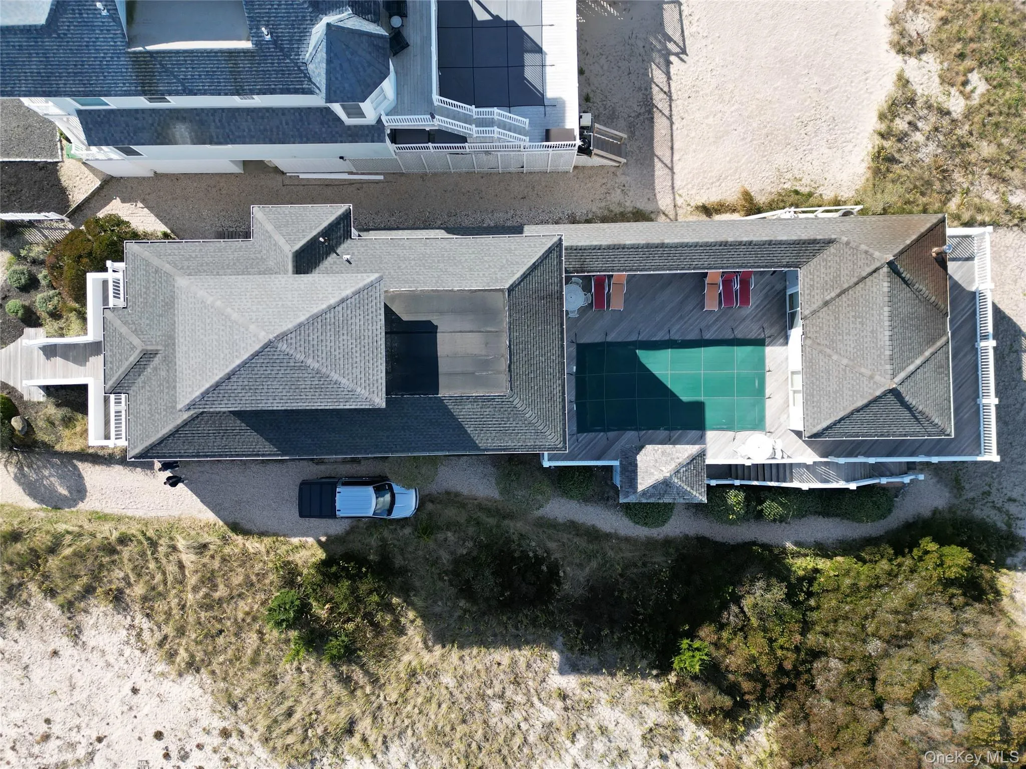 Aerial view of property and surrounding area with a pool area Aerial view of property and surrounding area with a pool area