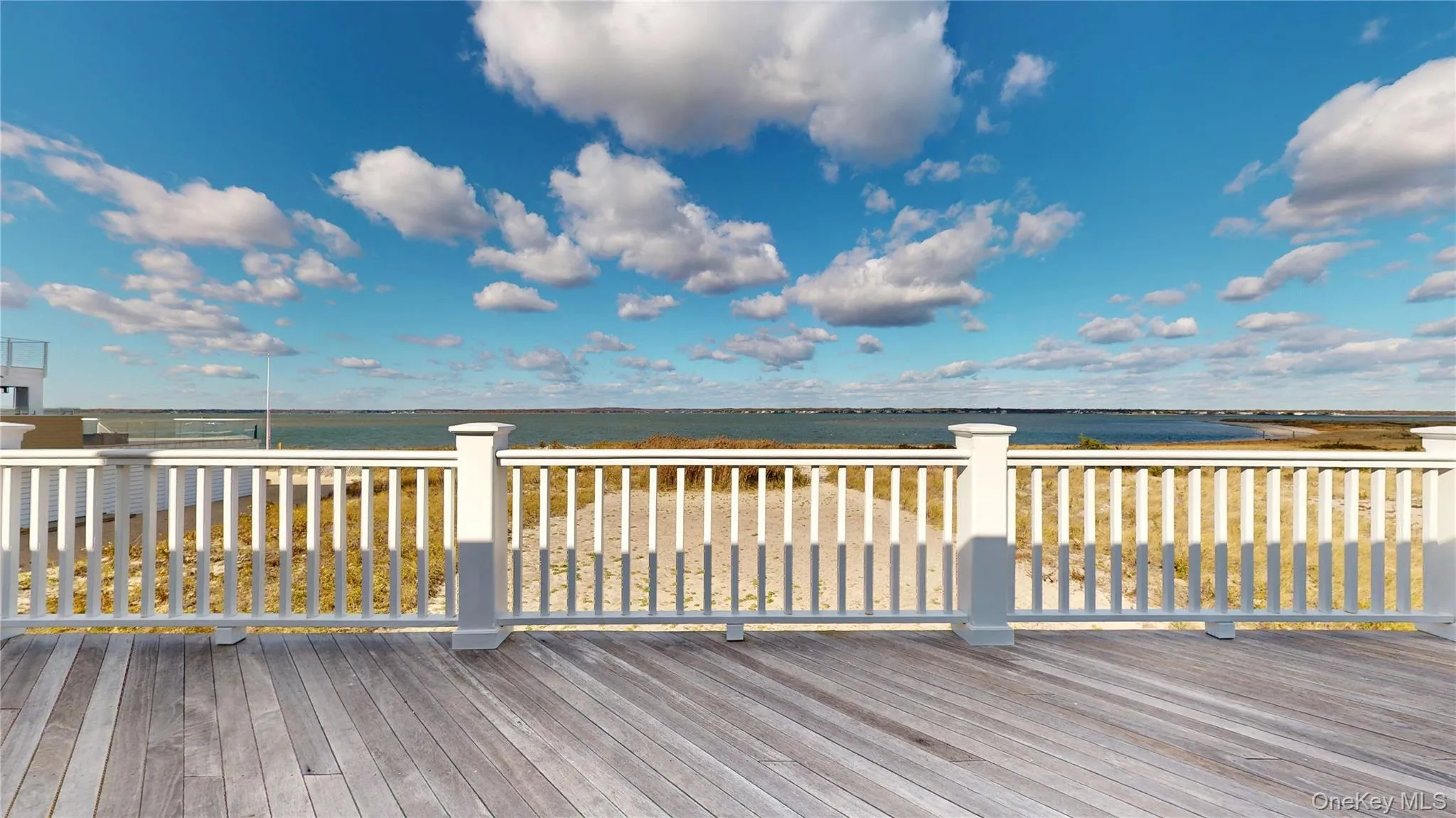 Wooden terrace featuring a water view Wooden terrace featuring a water view