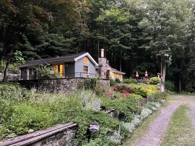 View of property exterior with a forest view View of property exterior with a forest view