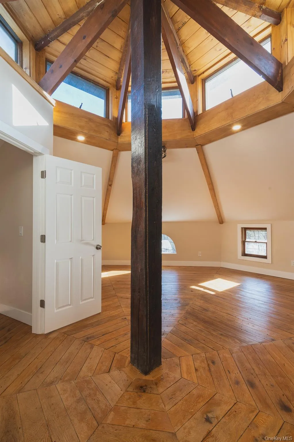 Additional living space with baseboards and parquet floors Additional living space with baseboards and parquet floors