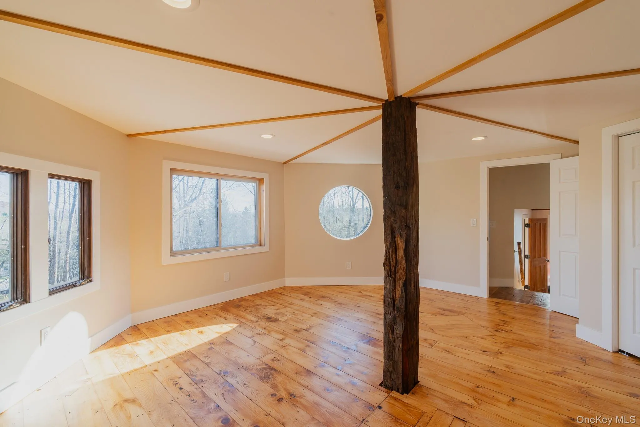 Unfurnished living room featuring recessed lighting and light wood-type flooring Unfurnished living room featuring recessed lighting and light wood-type flooring