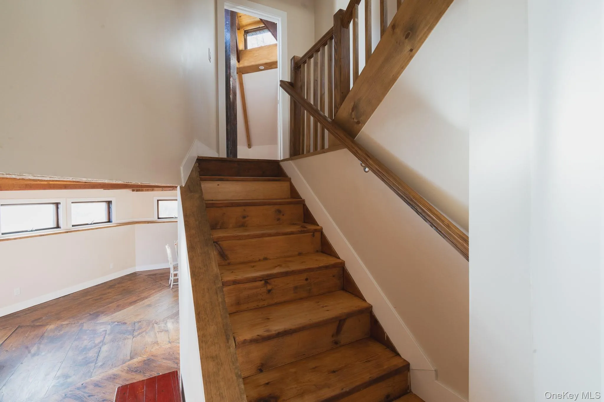 Stairs with hardwood / wood-style flooring and baseboards Stairs with hardwood / wood-style flooring and baseboards