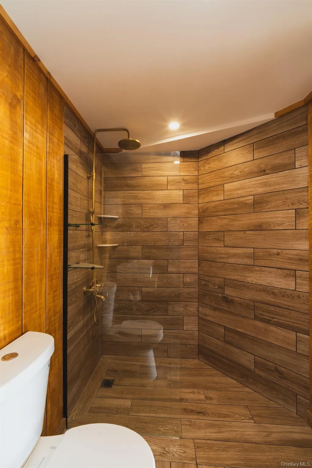 Full bath with toilet and a tile shower Full bath with toilet and a tile shower