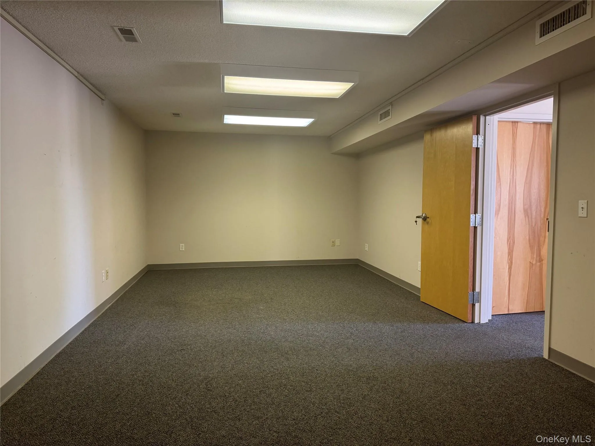 Spare room with dark carpet Spare room with dark carpet