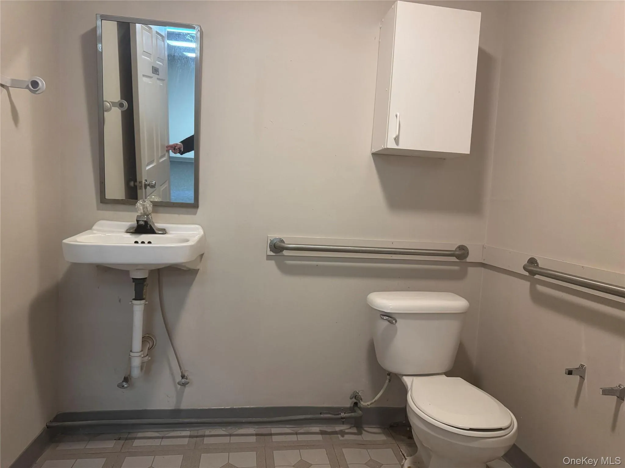 Half bathroom with baseboards and light flooring Half bathroom with baseboards and light flooring