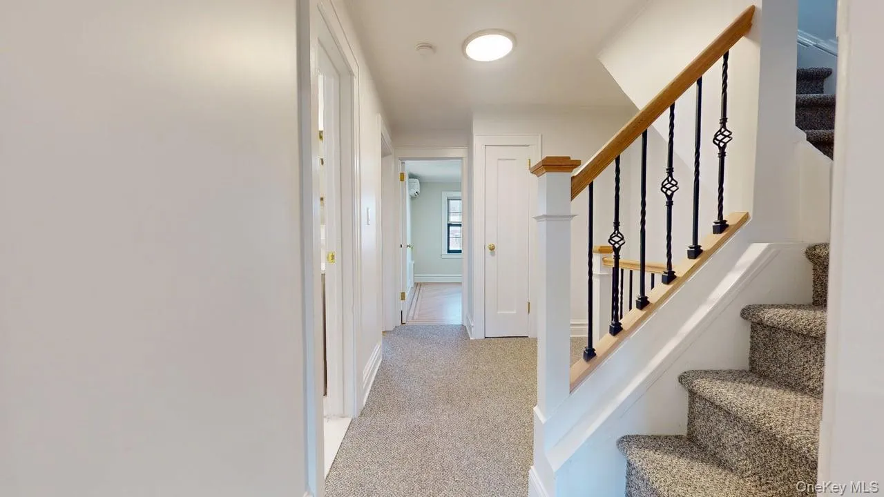 Stairs with carpet floors and baseboards Stairs with carpet floors and baseboards