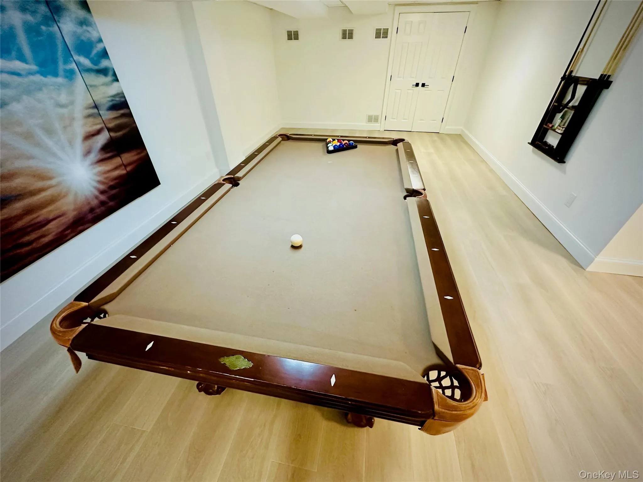Playroom with light wood-type flooring and pool table Playroom with light wood-type flooring and pool table