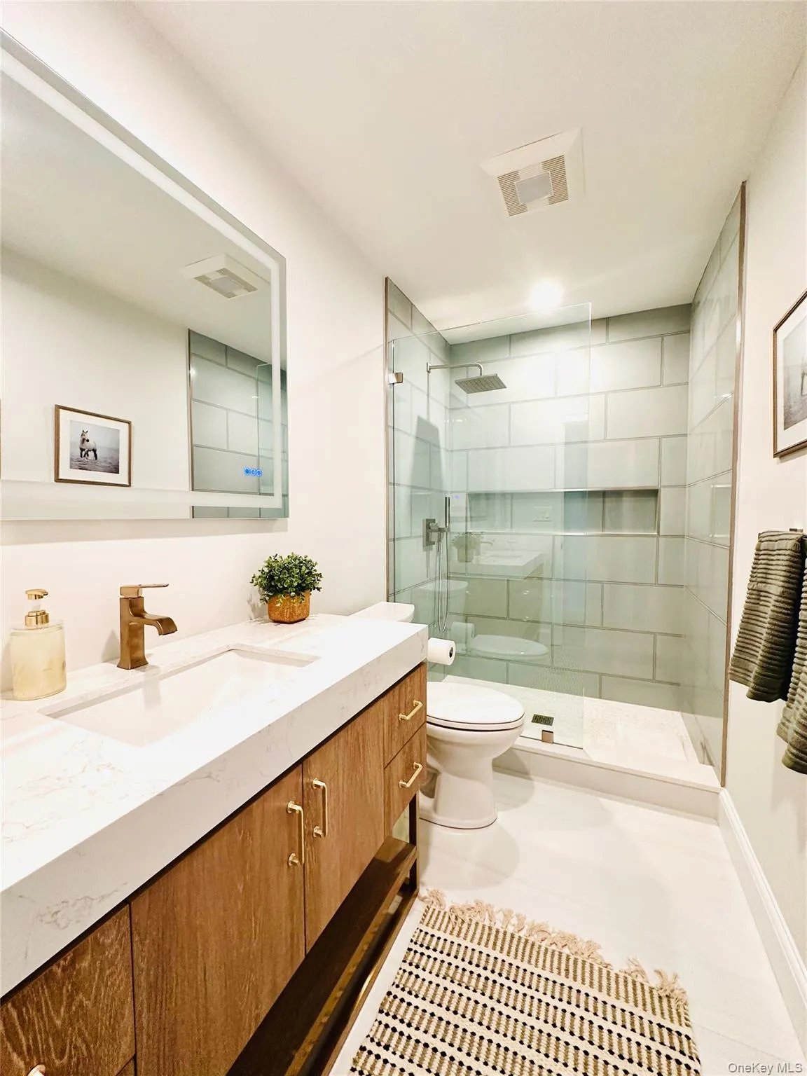 Full bath with vanity and a stall shower Full bath with vanity and a stall shower