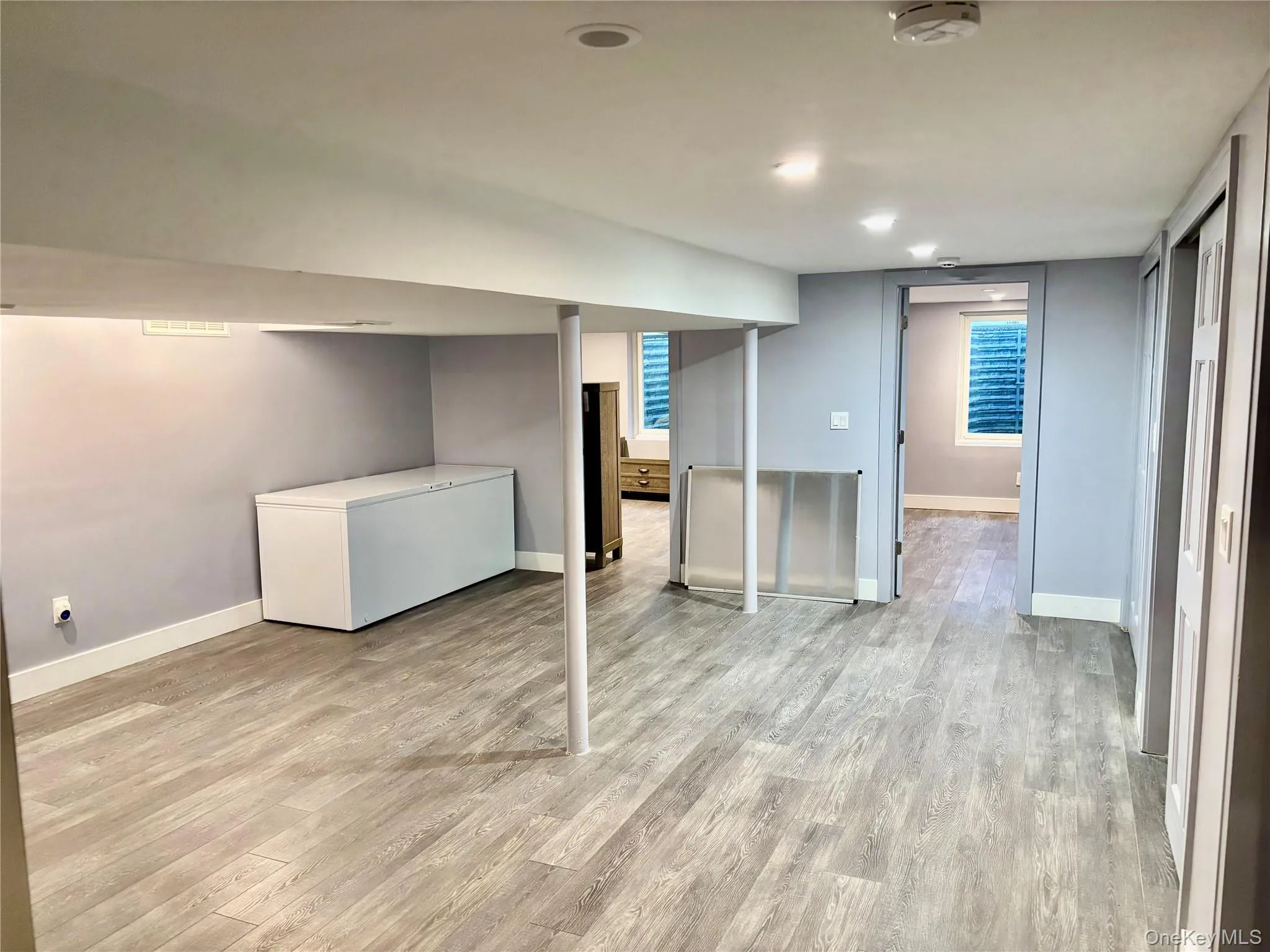 Finished lower level area featuring light wood-style floors Finished lower level area featuring light wood-style floors