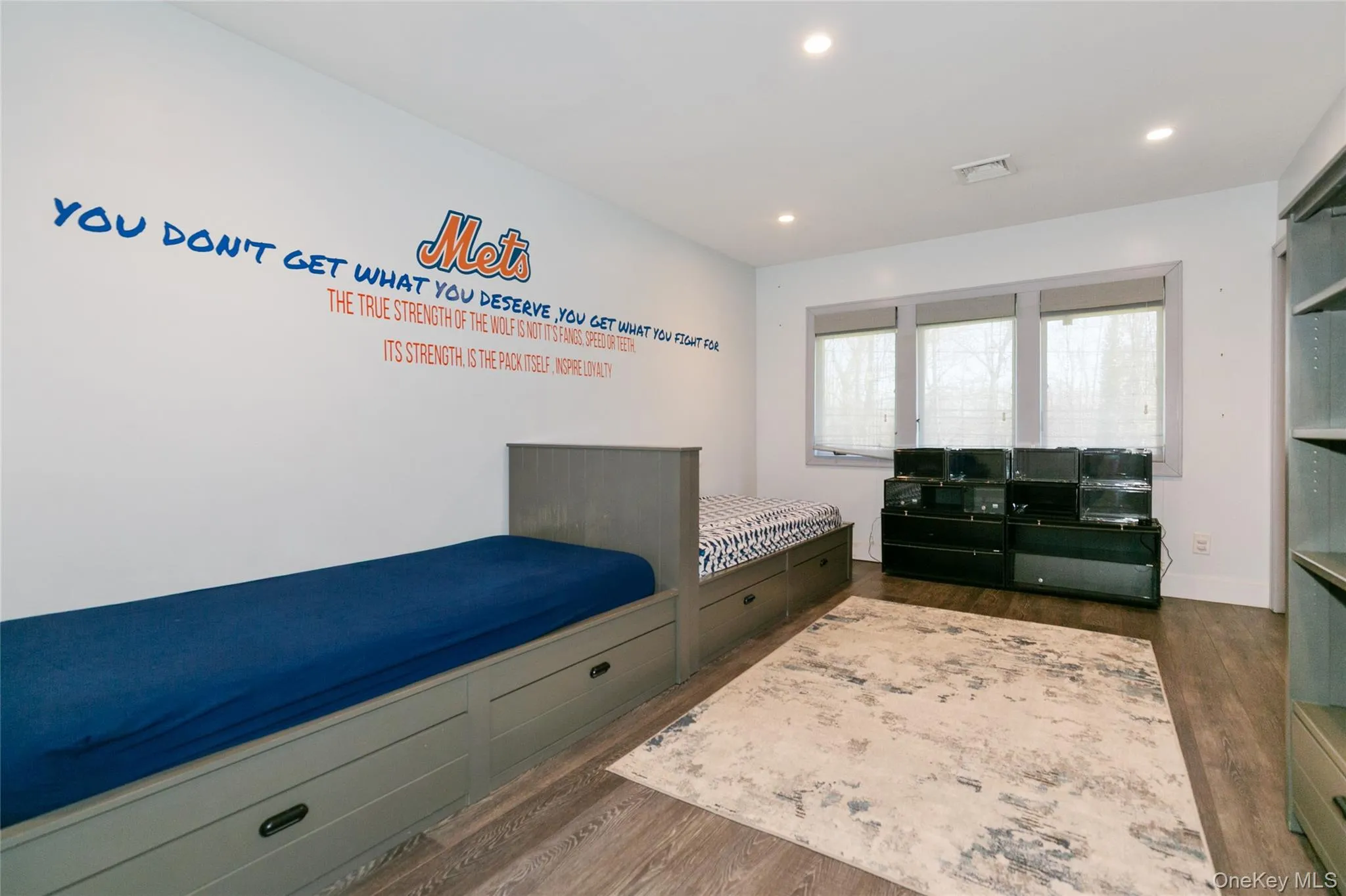 Bedroom with dark wood-style floors and recessed lighting Bedroom with dark wood-style floors and recessed lighting