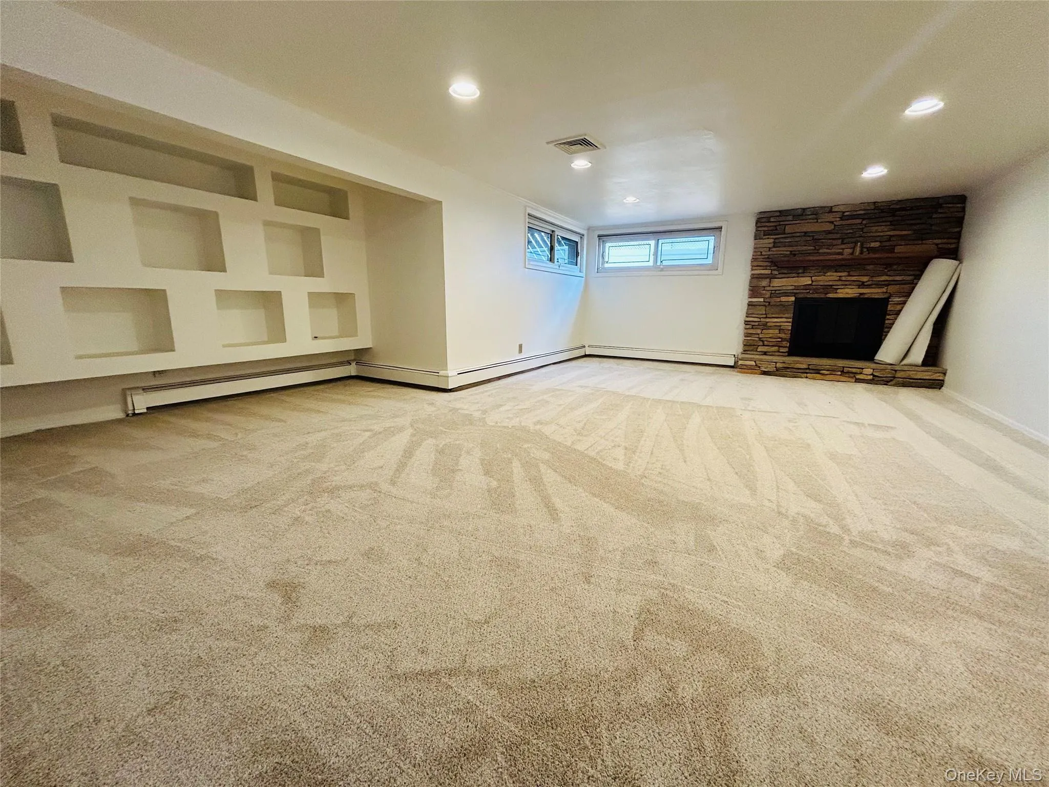 finished basement with new carpet and fireplace finished basement with new carpet and fireplace