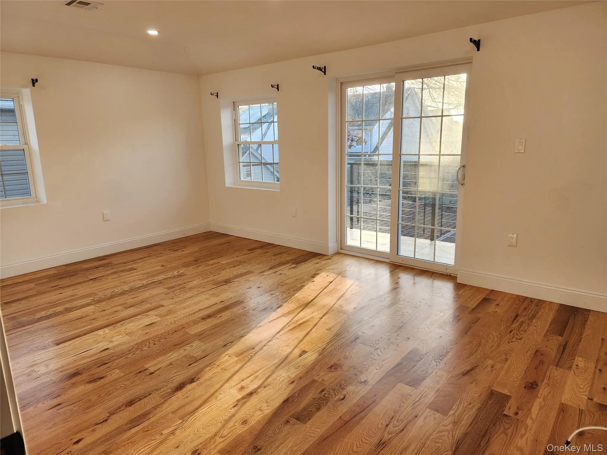 Empty room featuring light wood-style floors and recessed lighting Empty room featuring light wood-style floors and recessed lighting