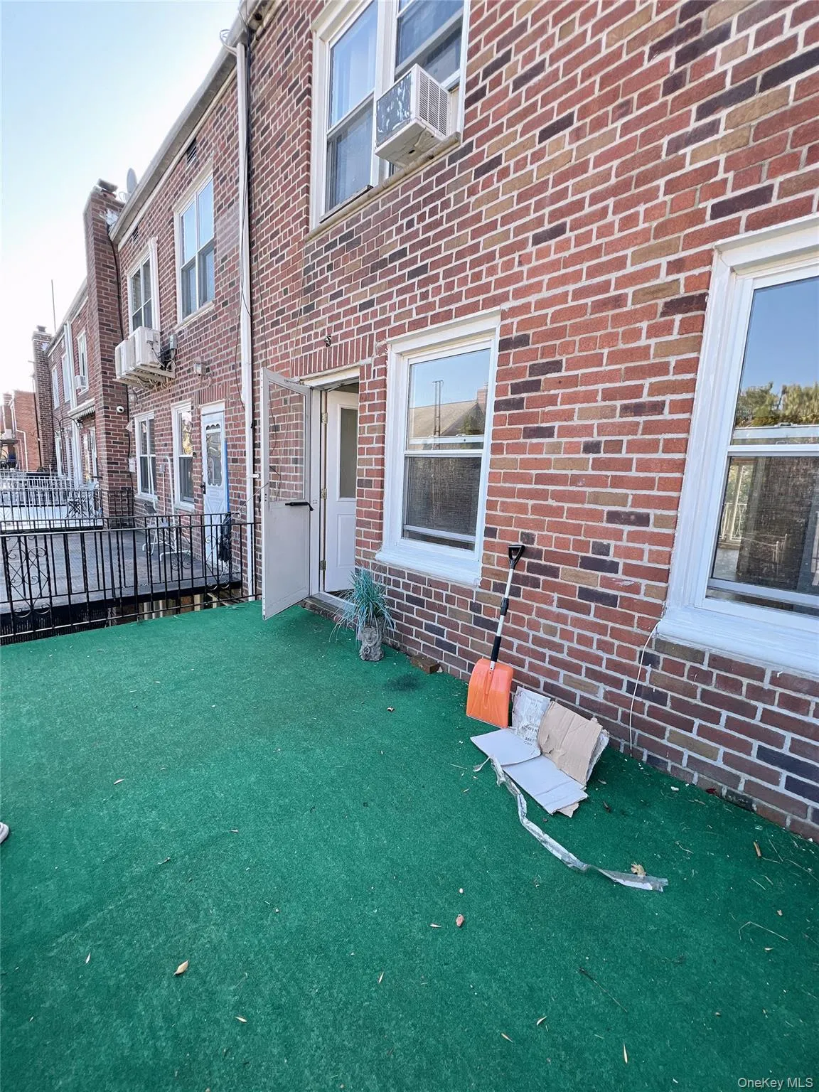 Property entrance with brick siding and a residential view Property entrance with brick siding and a residential view