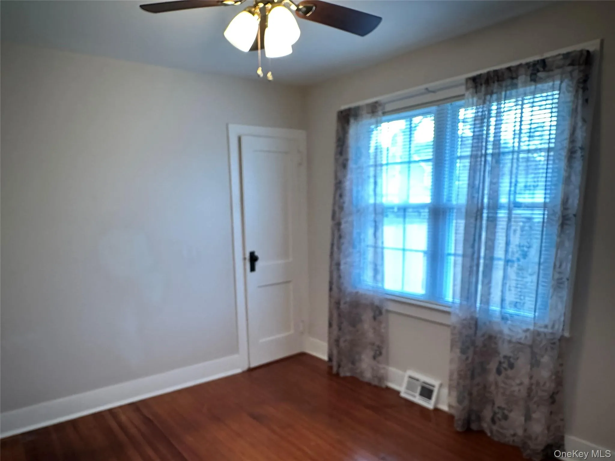1st Bedroom featuring dark wood-style flooring and ceiling fan 1st Bedroom featuring dark wood-style flooring and ceiling fan