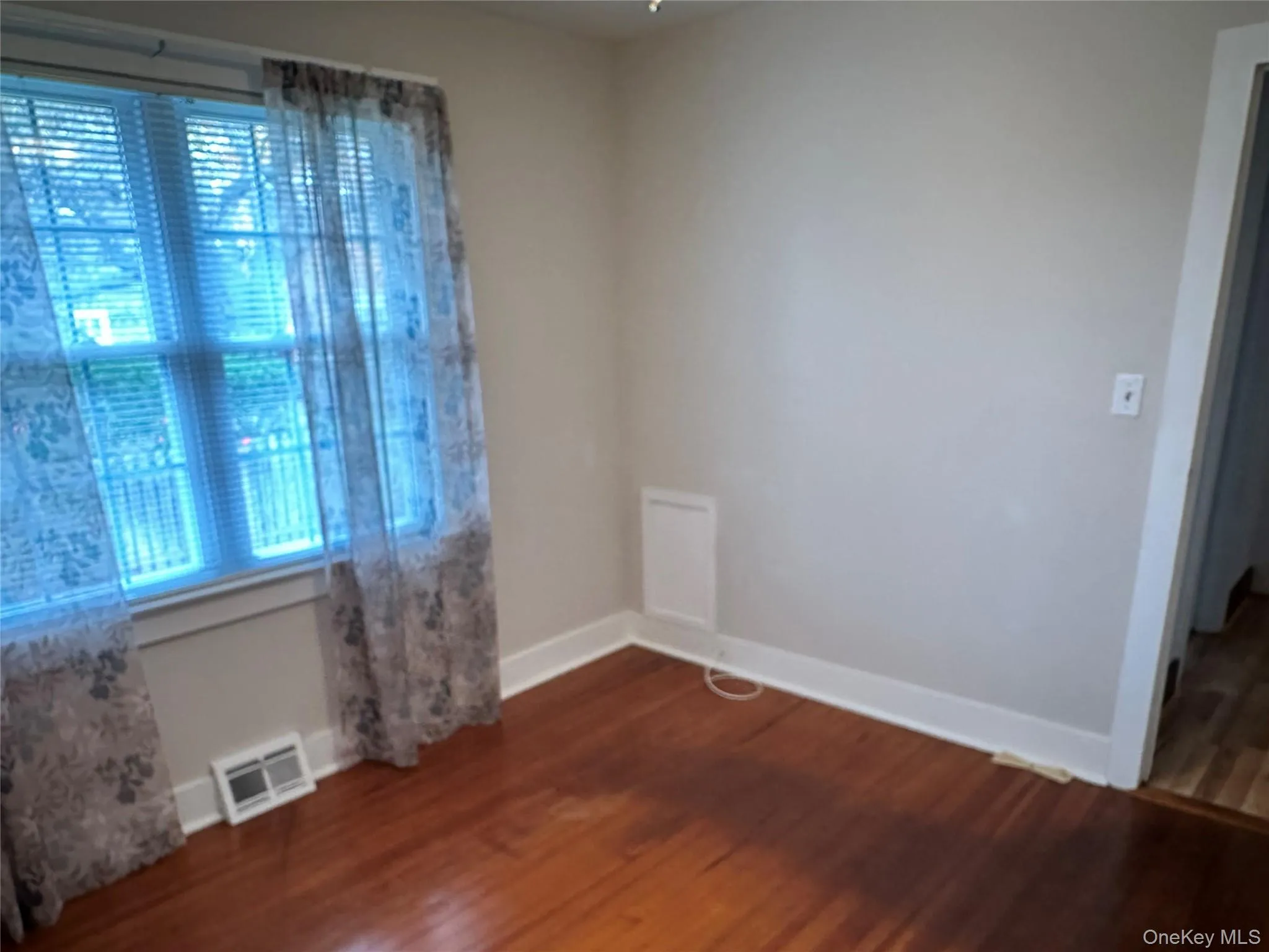 1st Bedroom with baseboards and dark wood-type flooring 1st Bedroom with baseboards and dark wood-type flooring