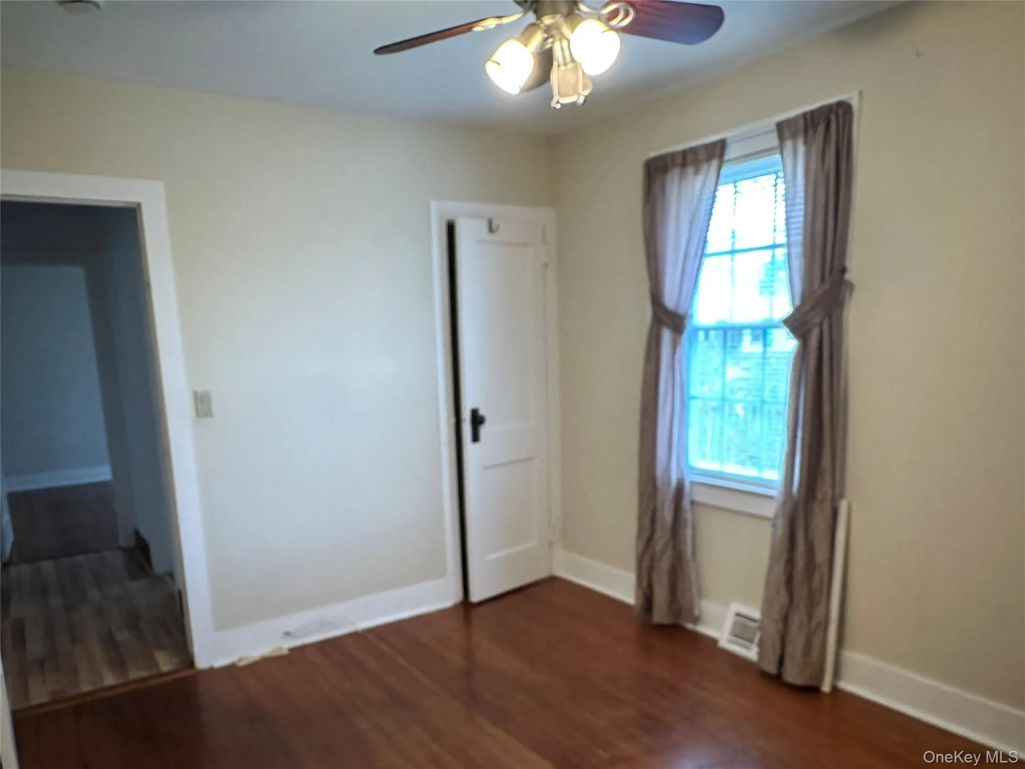 2nd Bedroom featuring dark wood-style floors and a ceiling fan 2nd Bedroom featuring dark wood-style floors and a ceiling fan