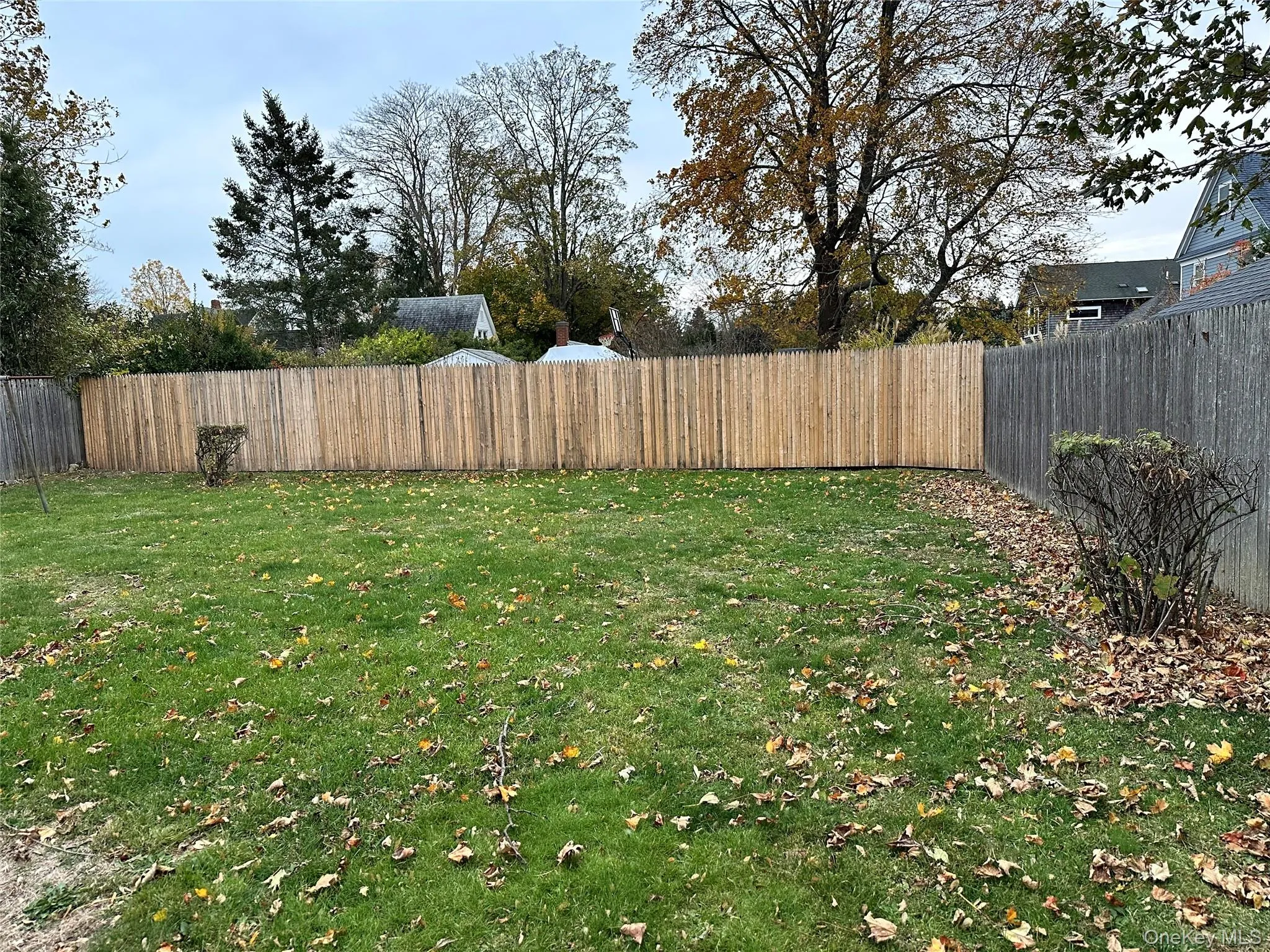 View of fully fenced backyard. New fencing recently installed. View of fully fenced backyard. New fencing recently installed.