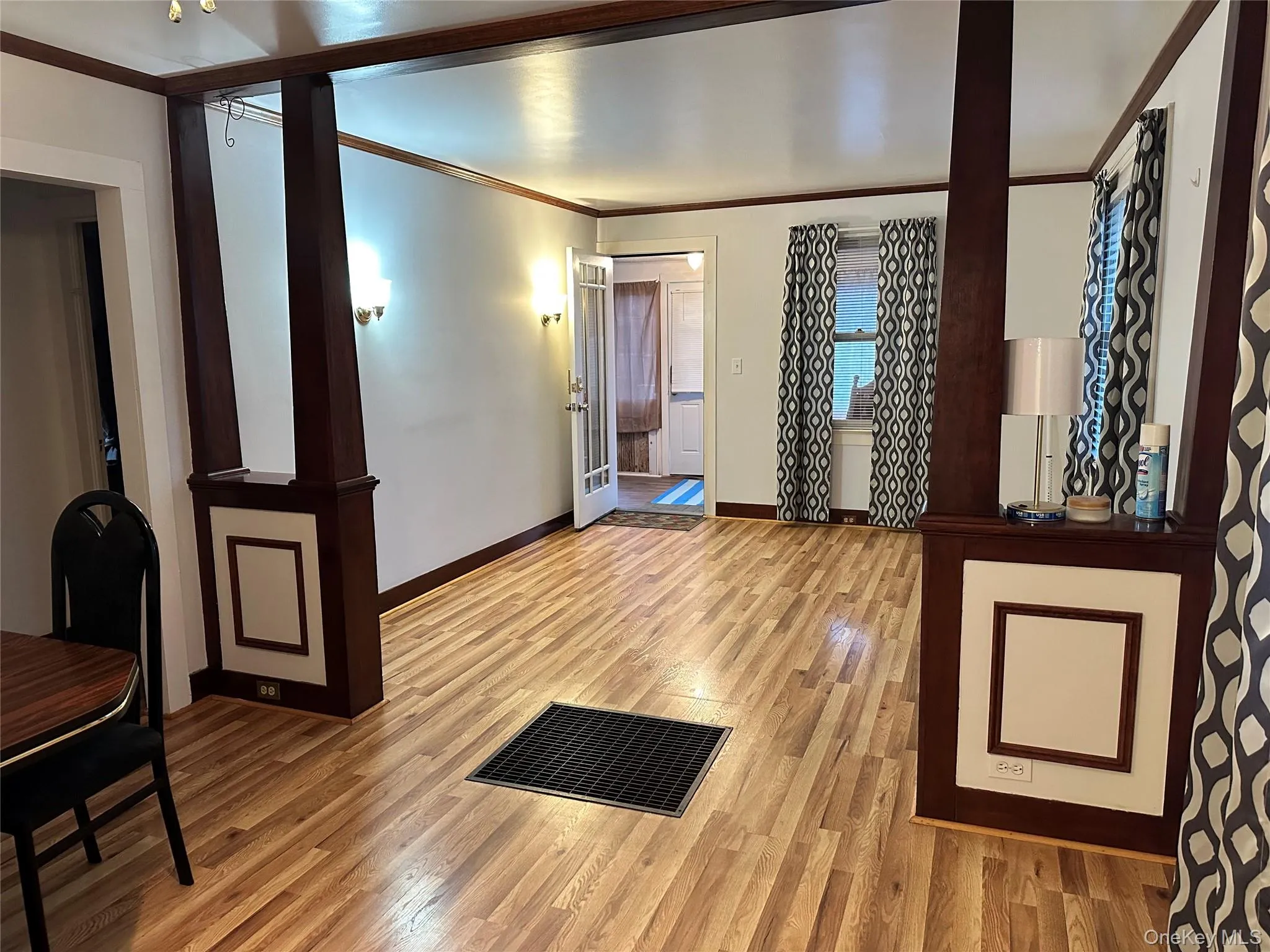 Dining Room featuring ornamental molding, light wood-style flooring and a ceiling fan. Dining Room featuring ornamental molding, light wood-style flooring and a ceiling fan.