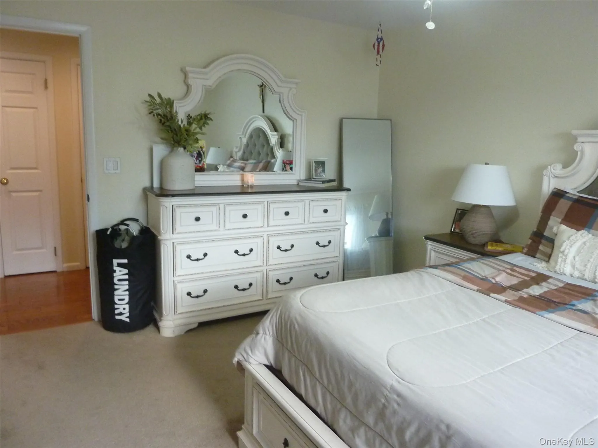 Bedroom with light carpet Bedroom with light carpet