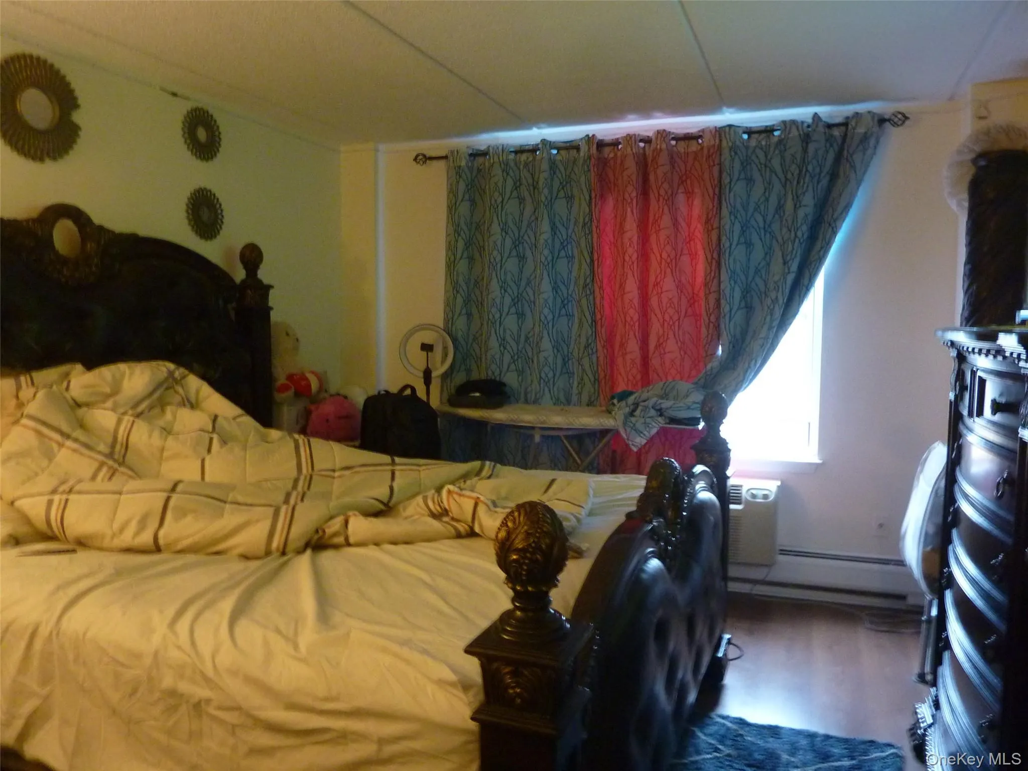 Bedroom featuring wood finished floors Bedroom featuring wood finished floors