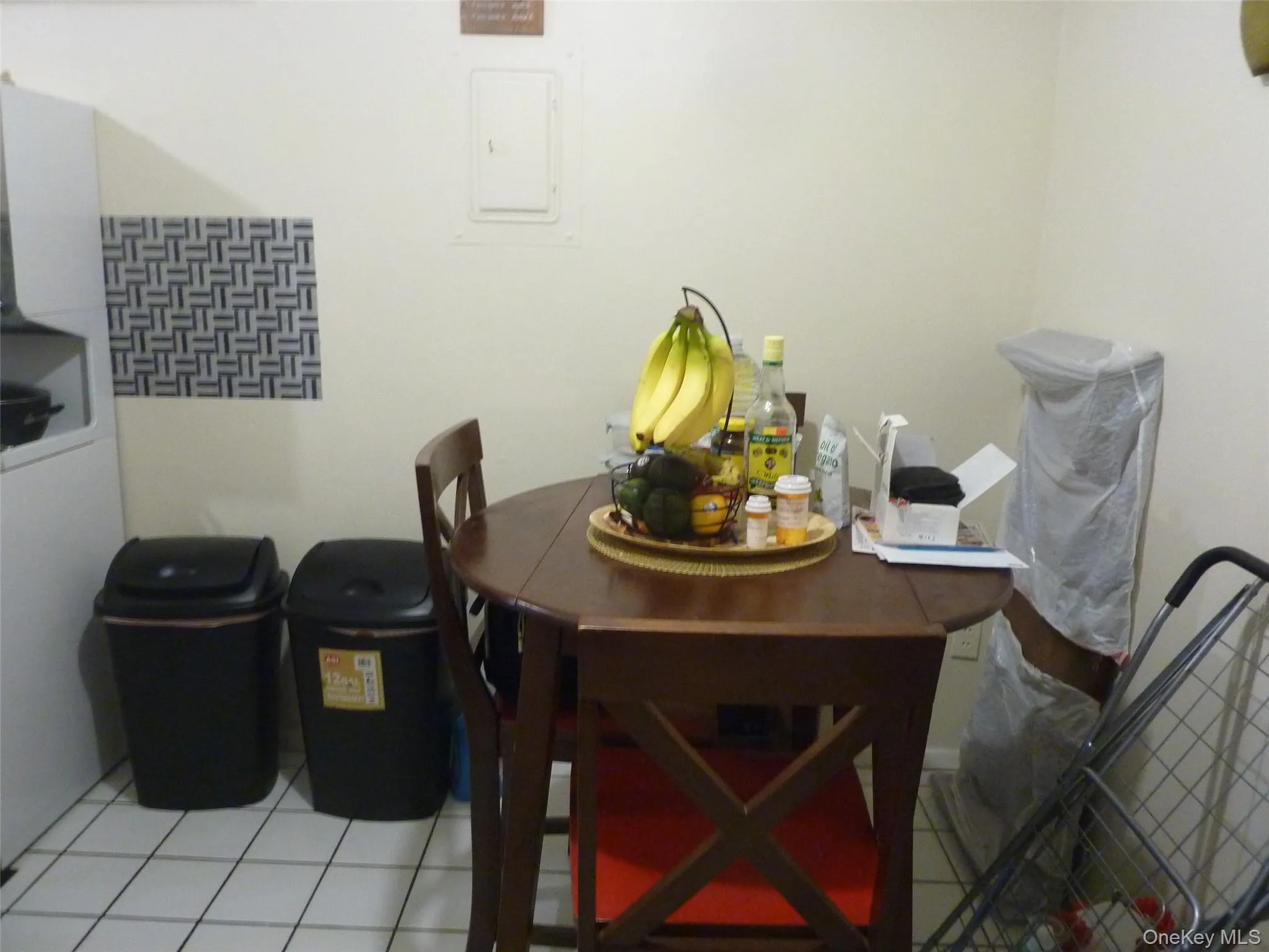 Tiled dining room with electric panel Tiled dining room with electric panel