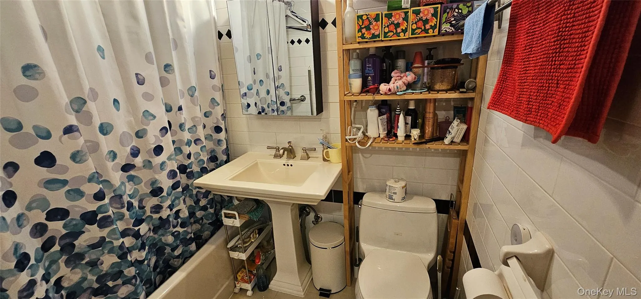 Bathroom with tile walls and shower / tub combo Bathroom with tile walls and shower / tub combo