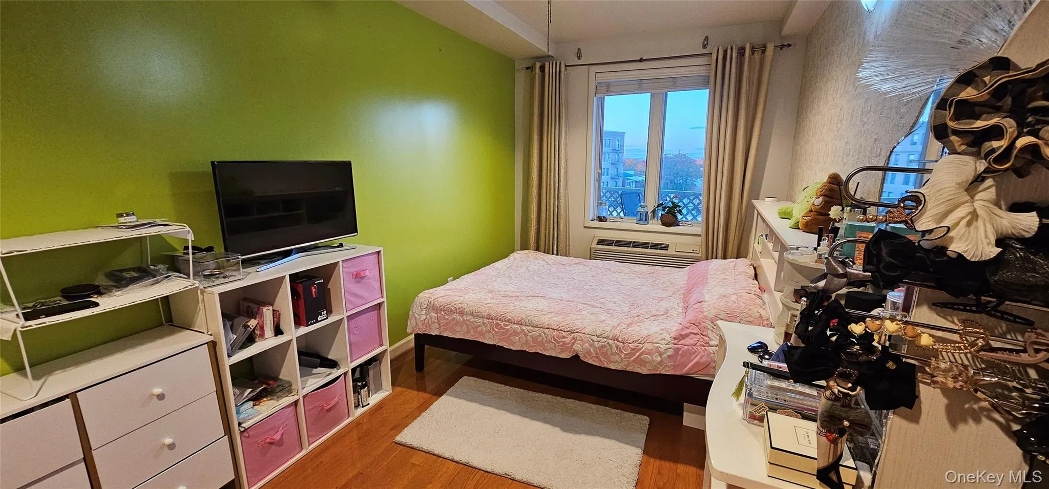 Bedroom with wood finished floors and baseboards Bedroom with wood finished floors and baseboards