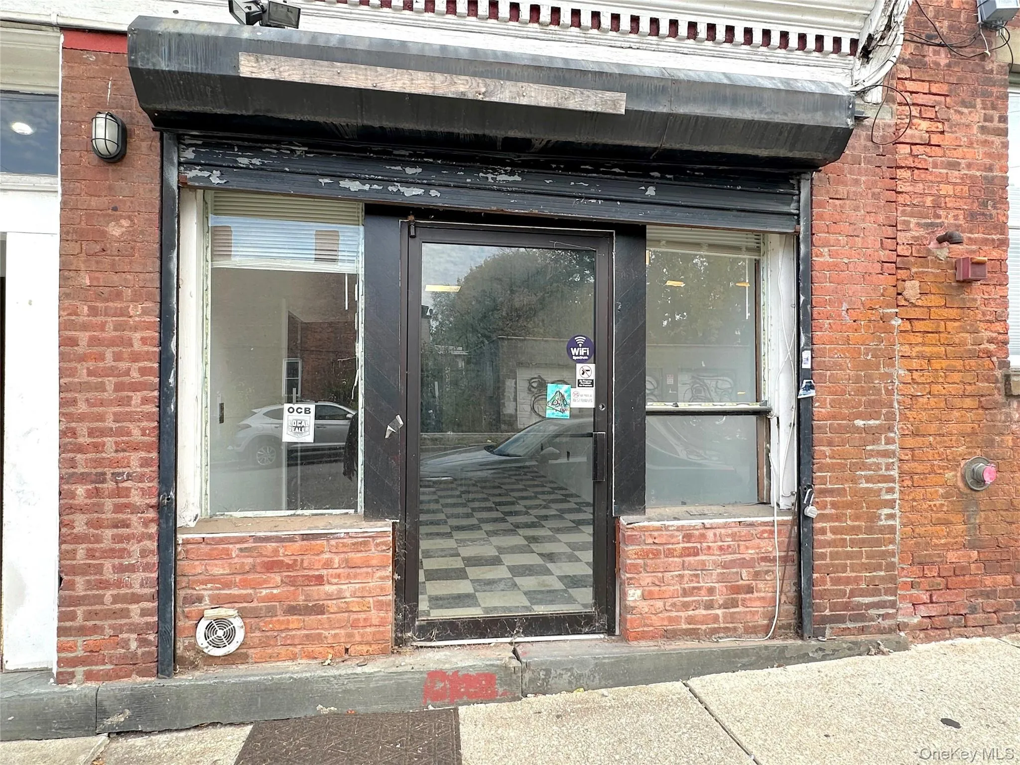 Property entrance with brick siding Property entrance with brick siding