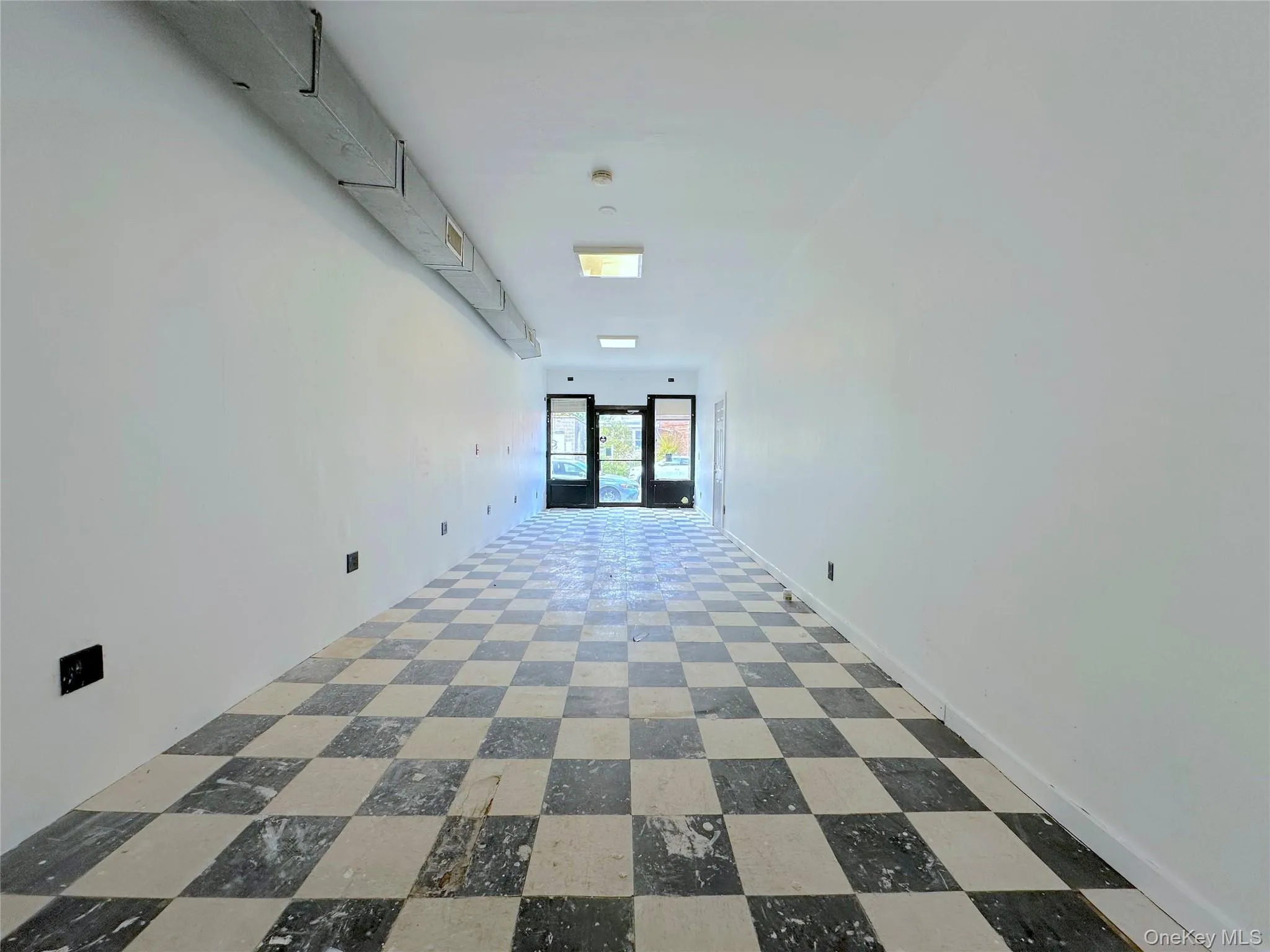 Unfurnished room featuring tile patterned floors Unfurnished room featuring tile patterned floors