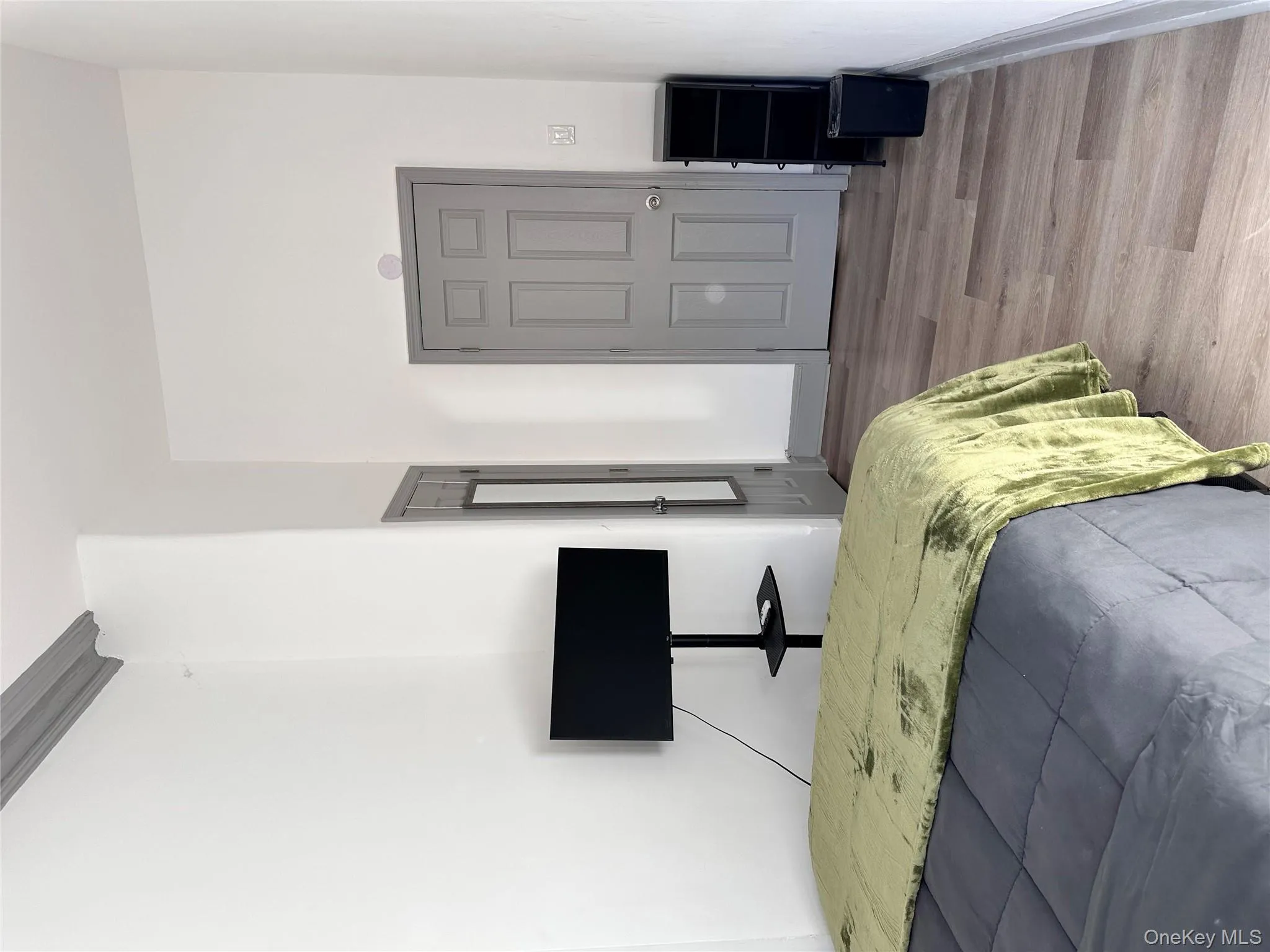 Bedroom featuring light wood-style floors and baseboards Bedroom featuring light wood-style floors and baseboards