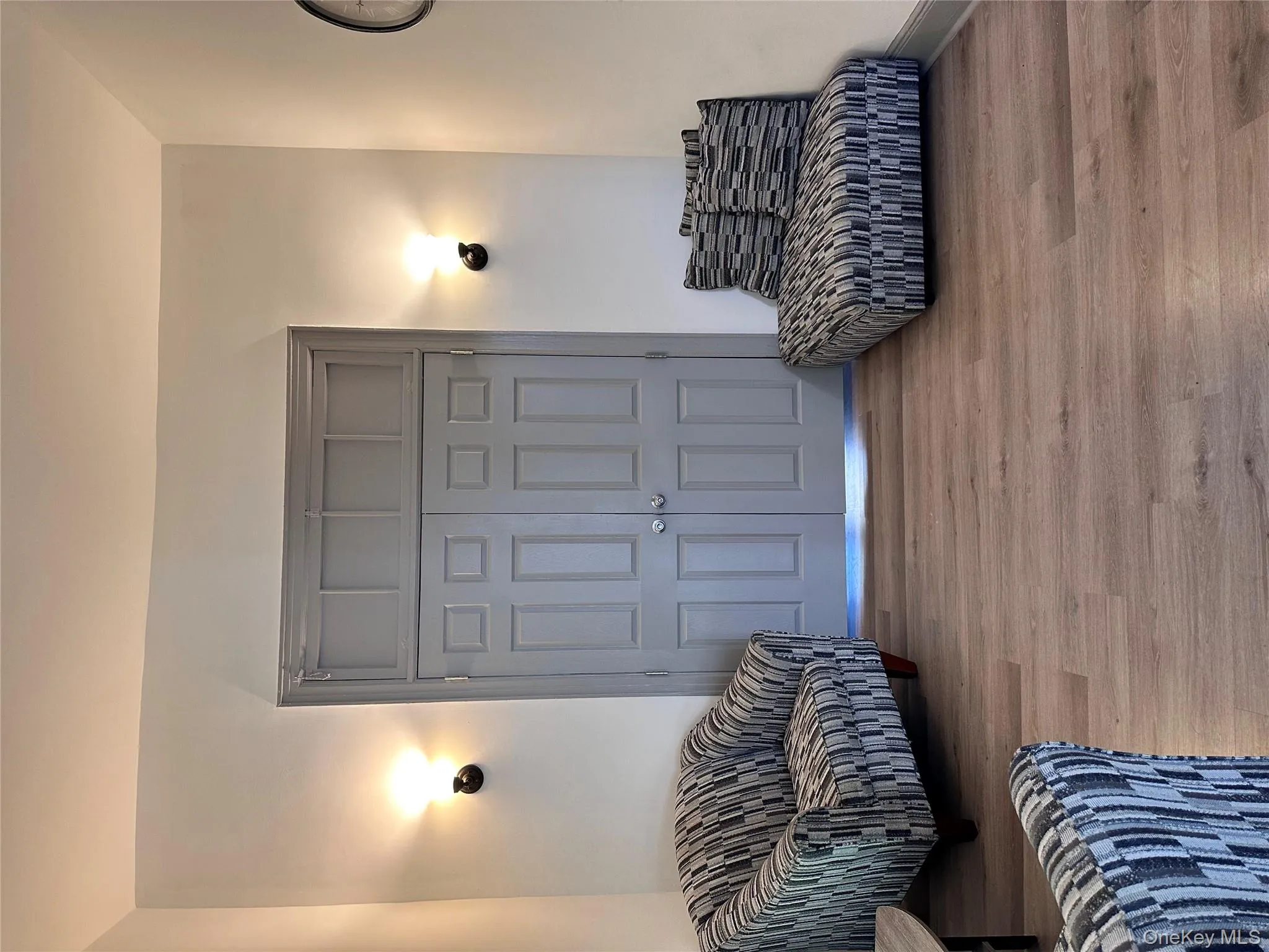 Living area featuring wood finished floors and baseboards Living area featuring wood finished floors and baseboards