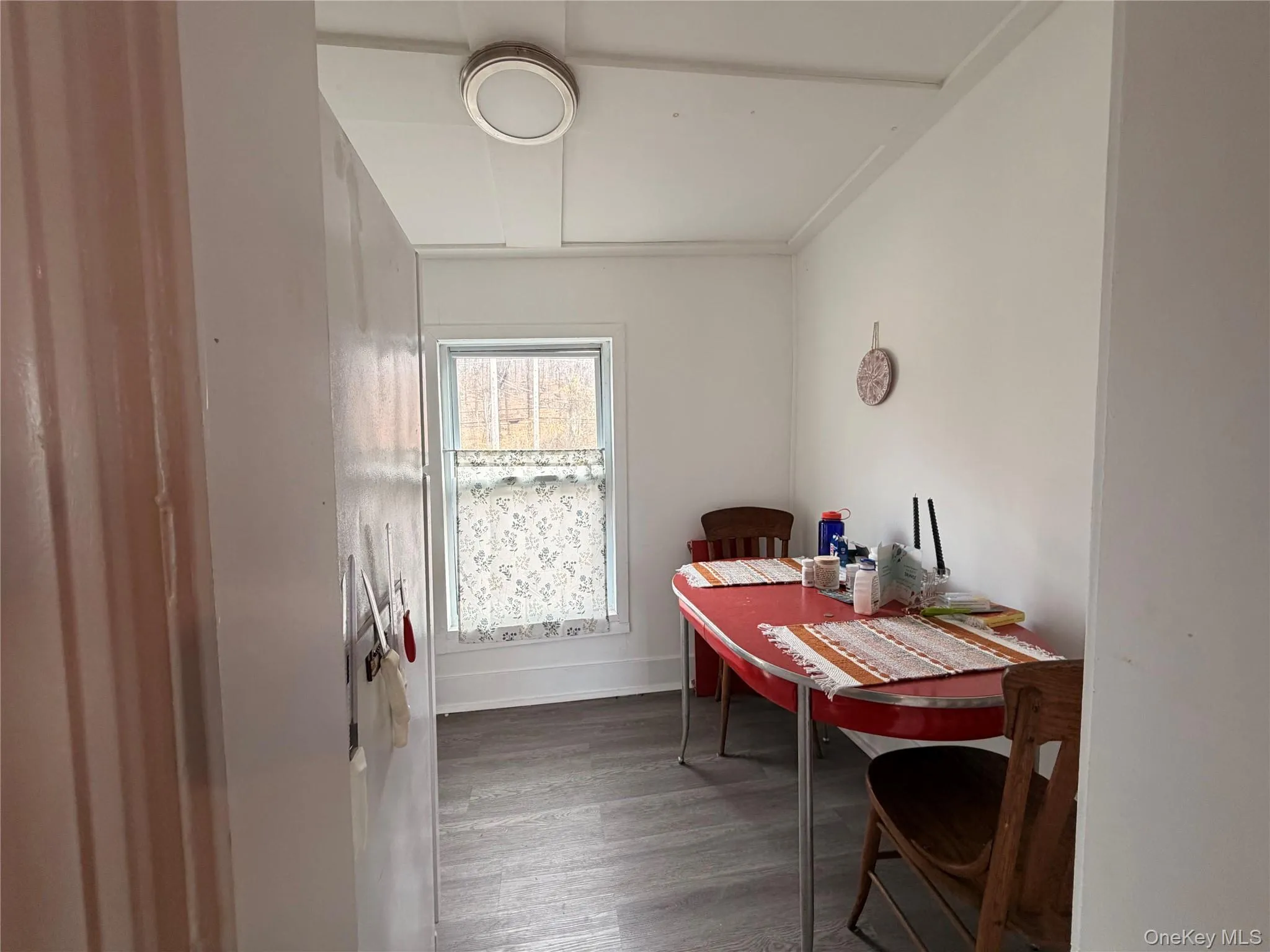 Dining area with dark wood-style floors Dining area with dark wood-style floors