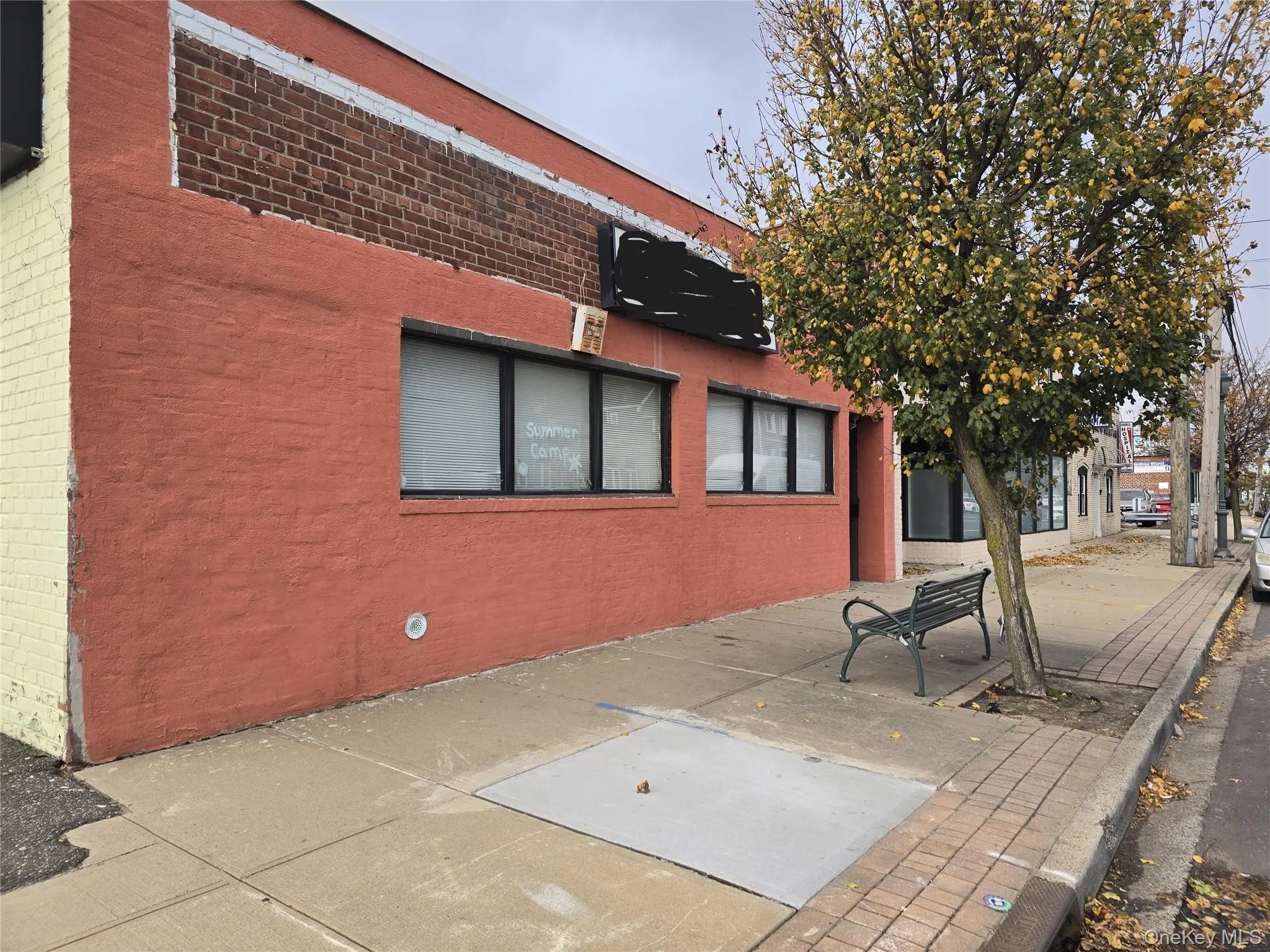 Rear view of property with brick siding Rear view of property with brick siding