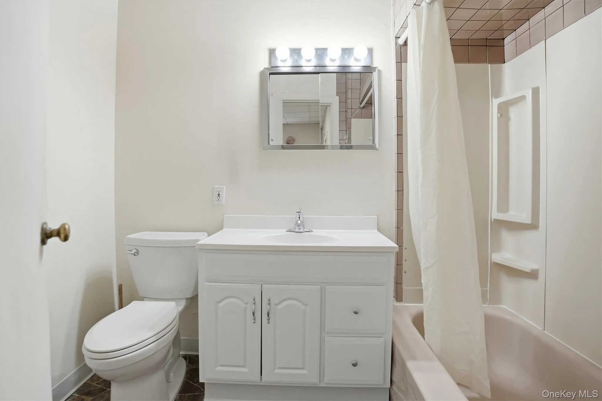 Bathroom with vanity and shower / bath combo Bathroom with vanity and shower / bath combo